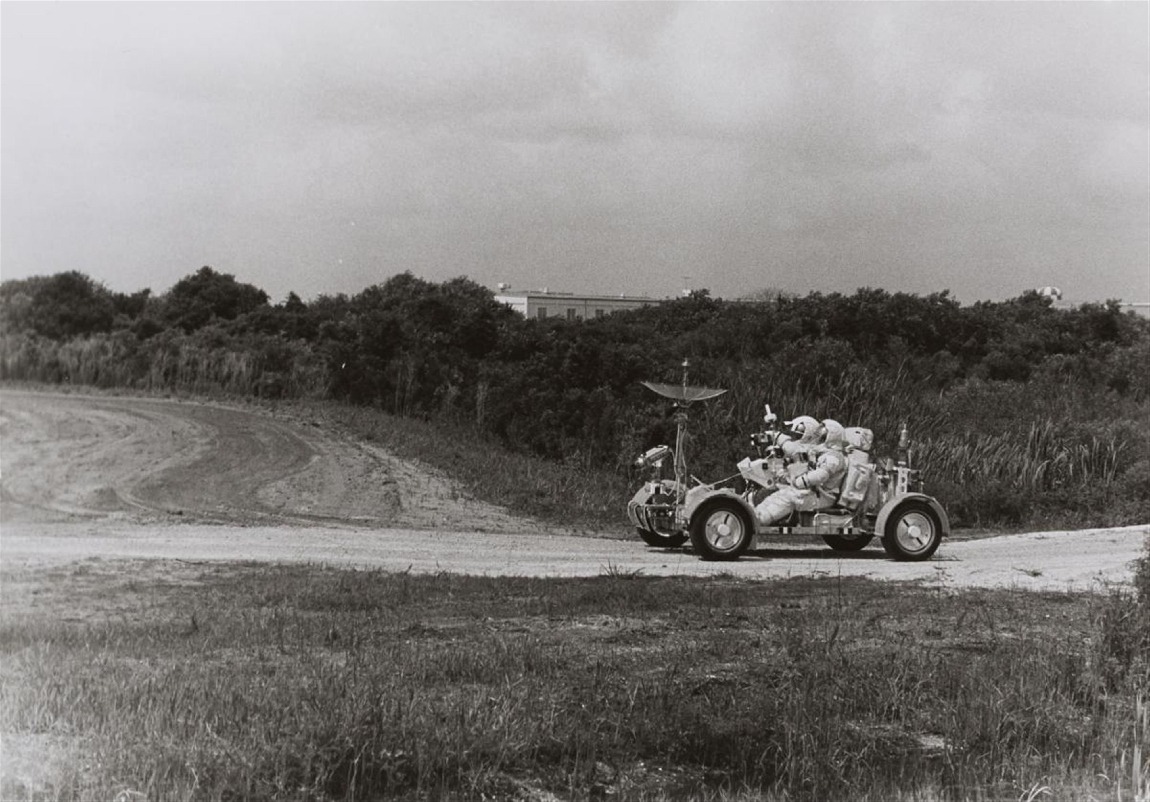 NASA - Apollo 15 backup astronauts Gordon Jr. and Schmitt drive a training model of the lunar roving vehicle, Kennedy Space Center - image-1
