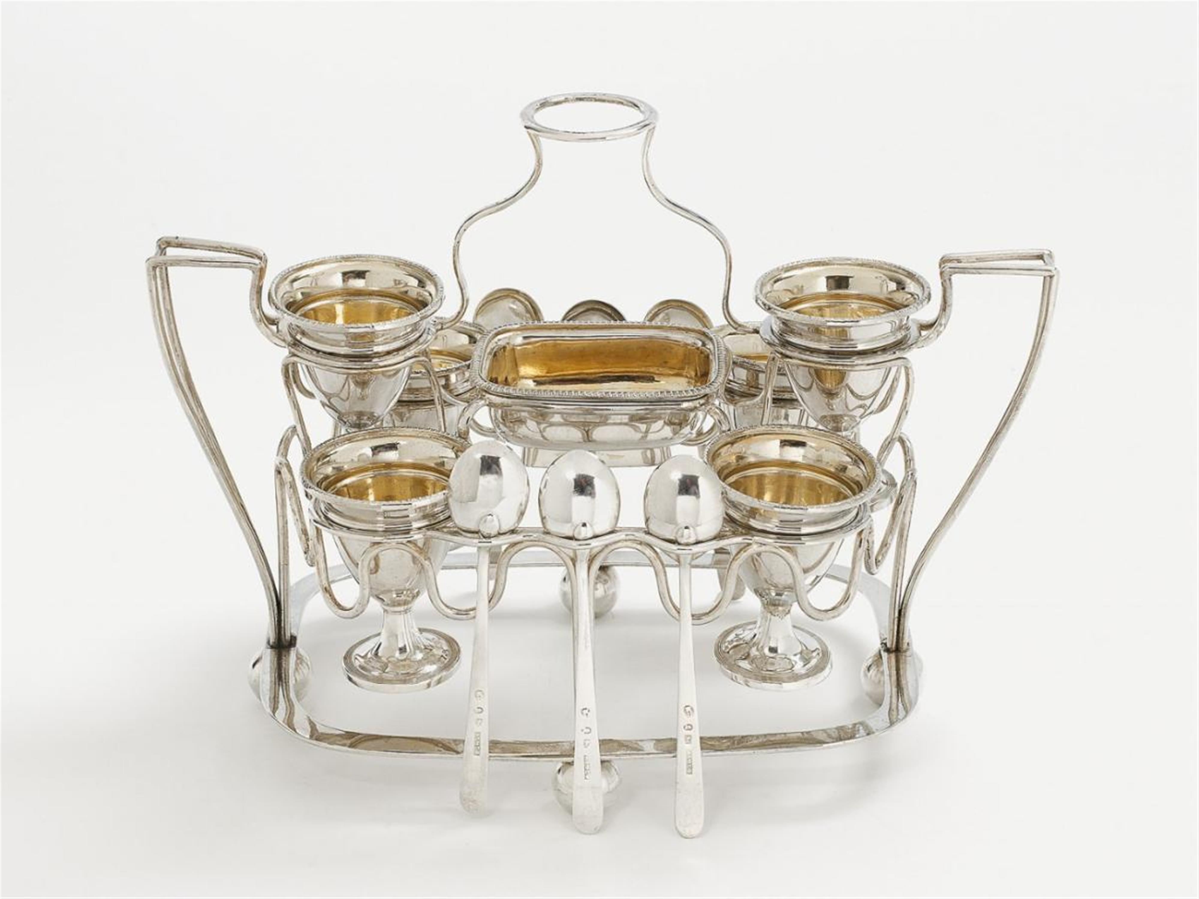 A George III Sheffield silver partially gilt egg stand. Comprising 6 egg cups, 6 spoons and a salt. Marks of Alexander Goodman & Co, 1805. - image-1