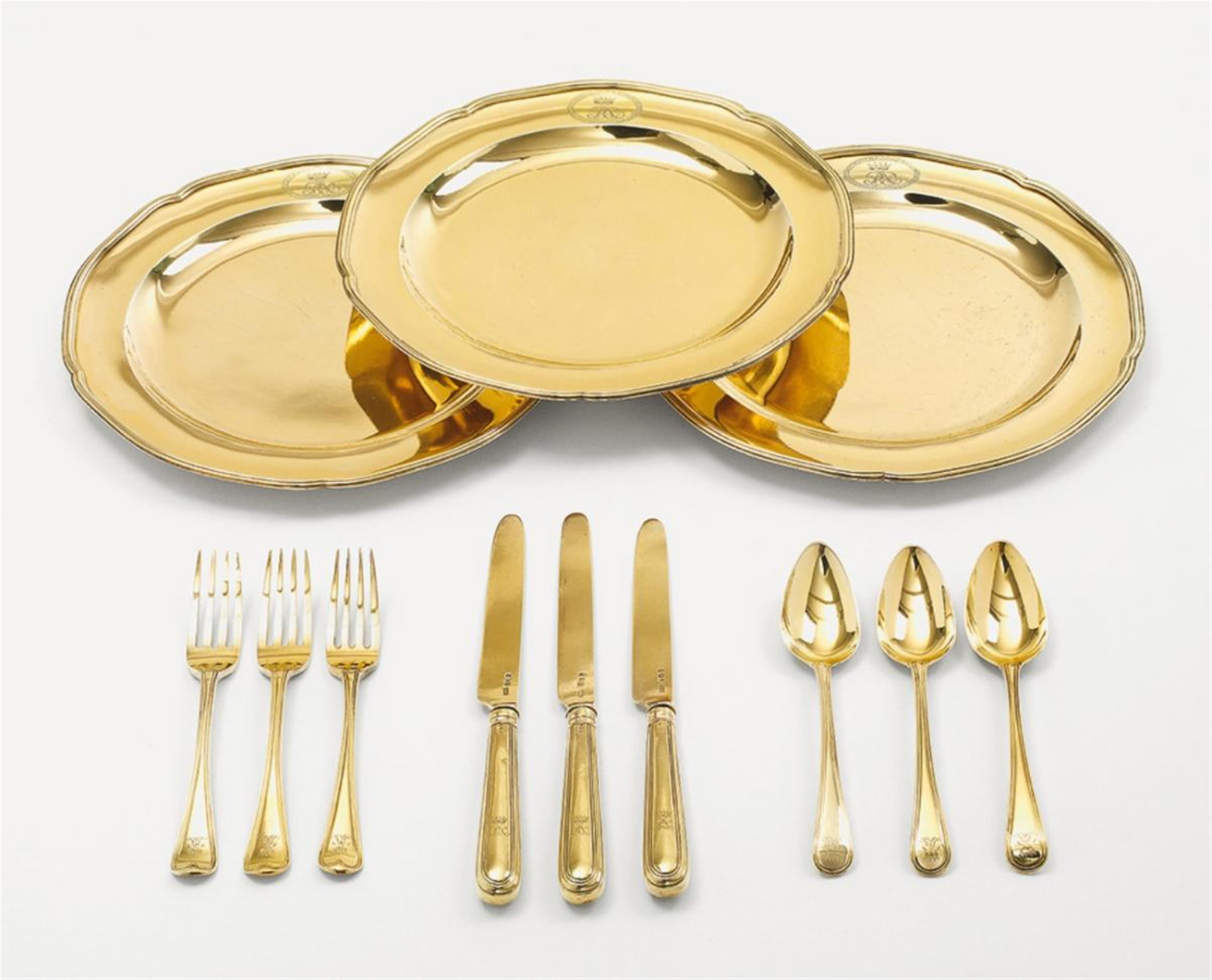 Three George III silver gilt dessert sets, all monogrammed with a crowned "R". Comprising plates, knives, forks and spoons. Various marks, London 1794 -1837. - image-1