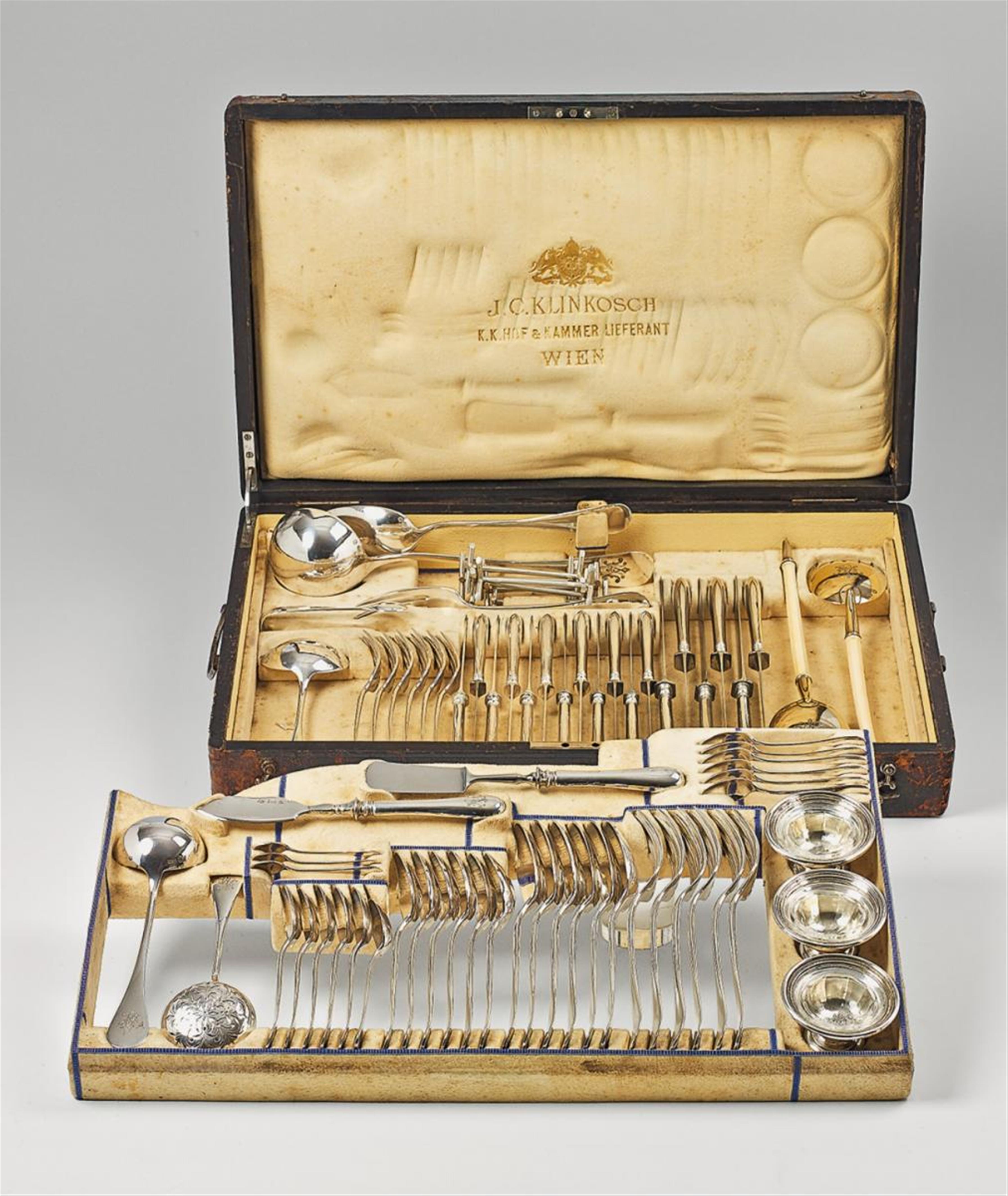 A Vienna silver cutlery set. Comprising six each of dinner and dessert knives, forks, spoons, coffee spoons, mocca spoons, seven serving pieces, salad cutlery, a sugar sieve, sugar tongs, three salt dishes and six knife holders. All monogrammed RM. In ori - image-1