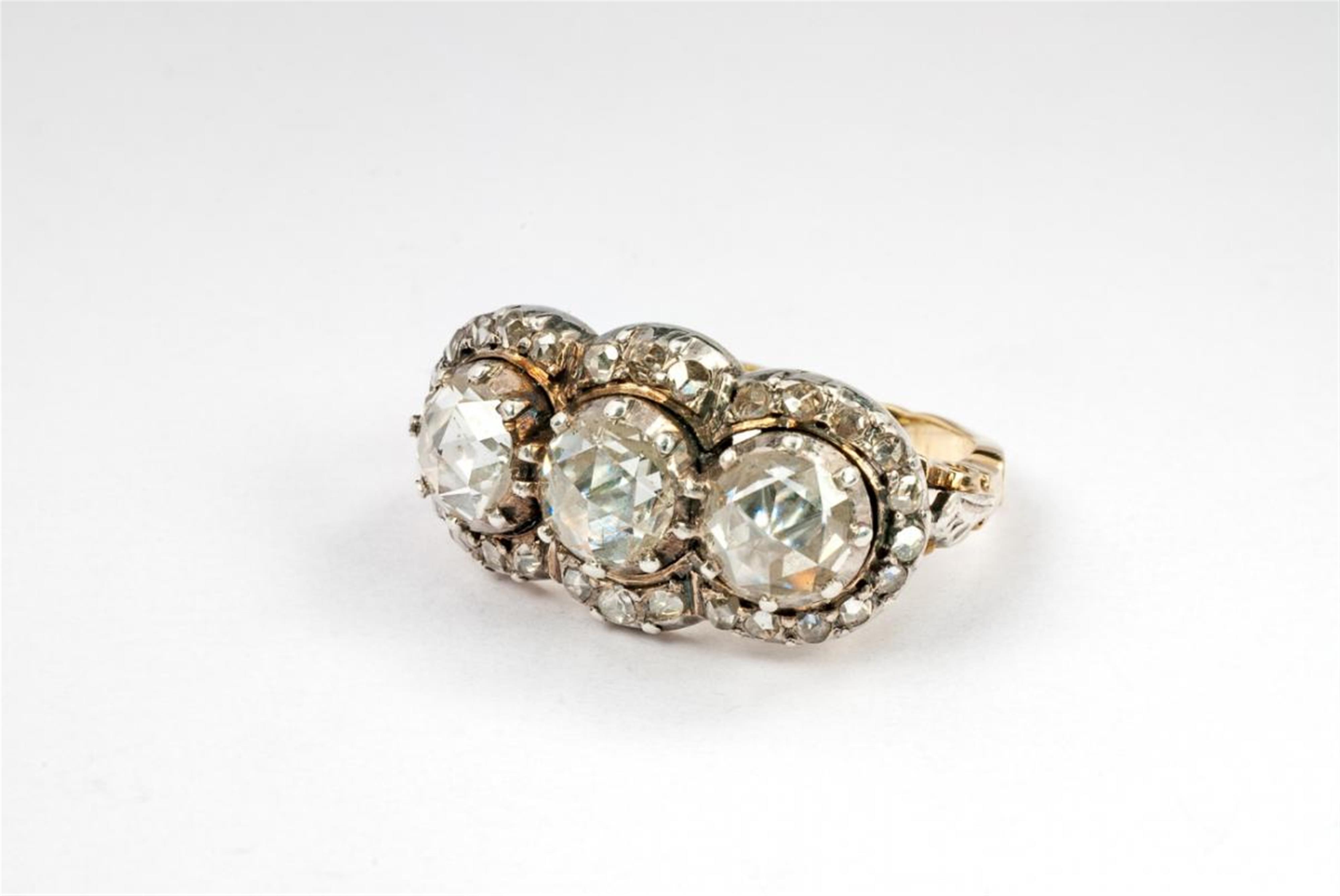 A silver, 14 ct gold and diamond three stone ring. - image-1