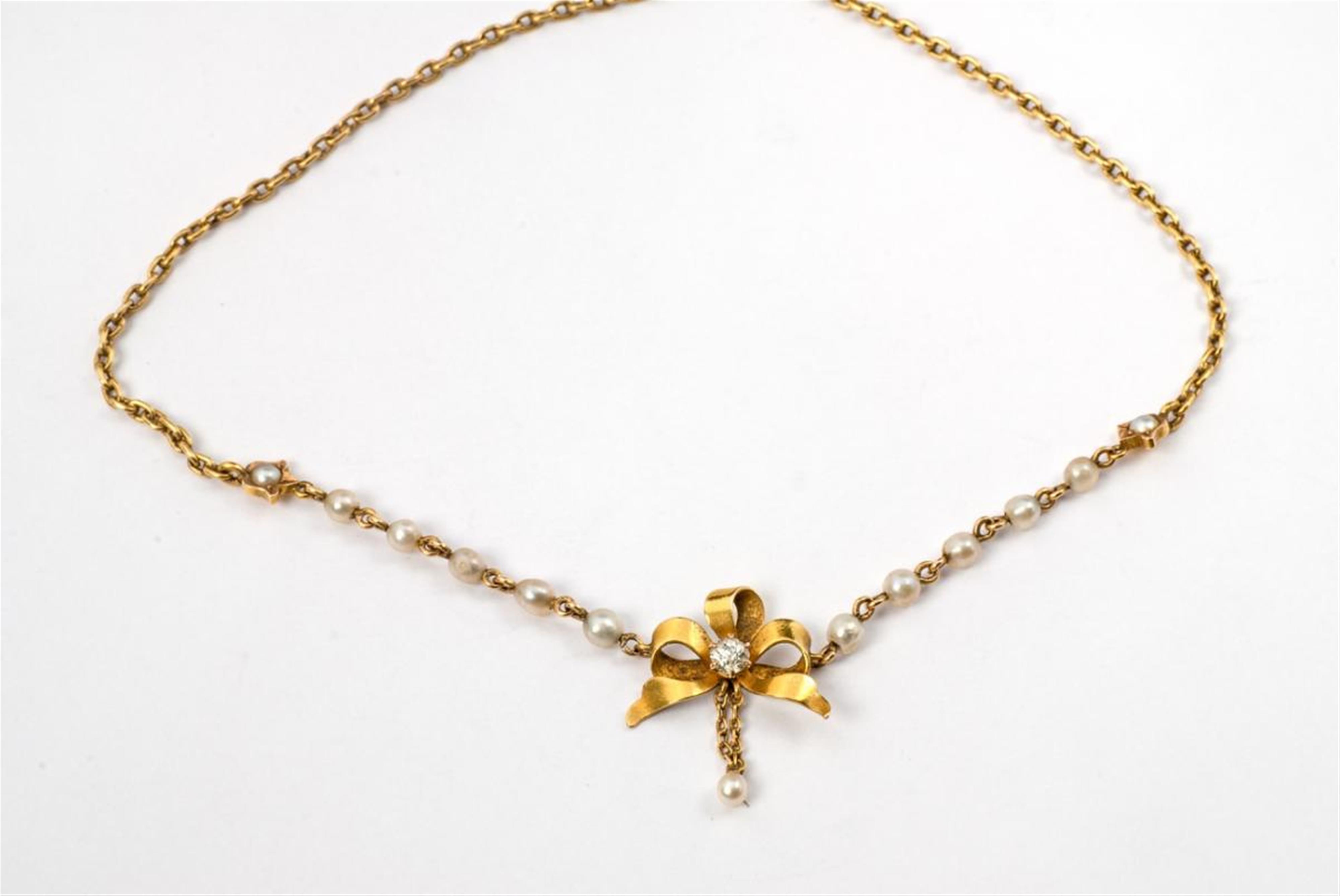 A Belle Epoque 14 ct gold, pearl and diamond bow necklace. - image-1