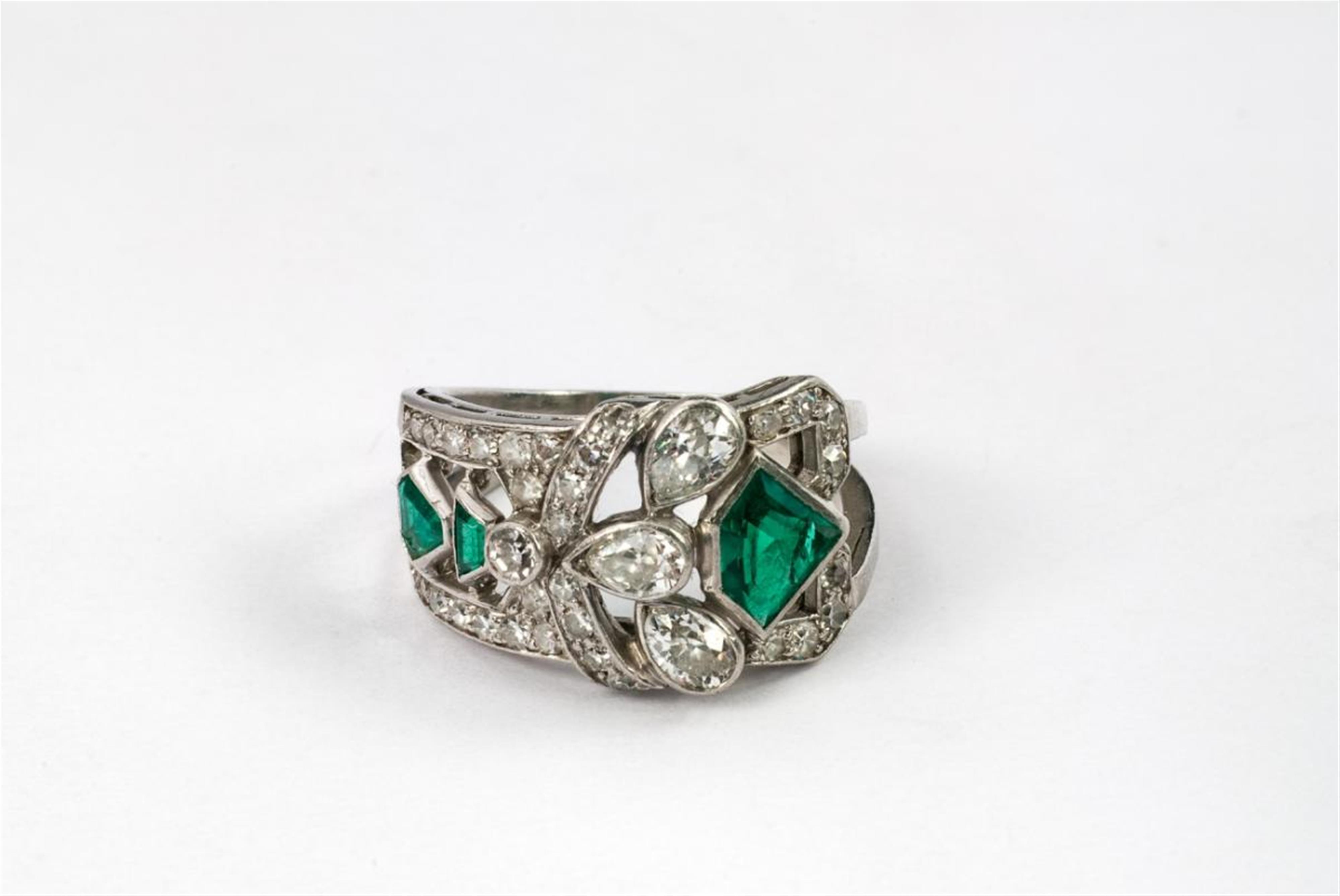 An Art Déco platinum, diamond and emerald ring. - image-1