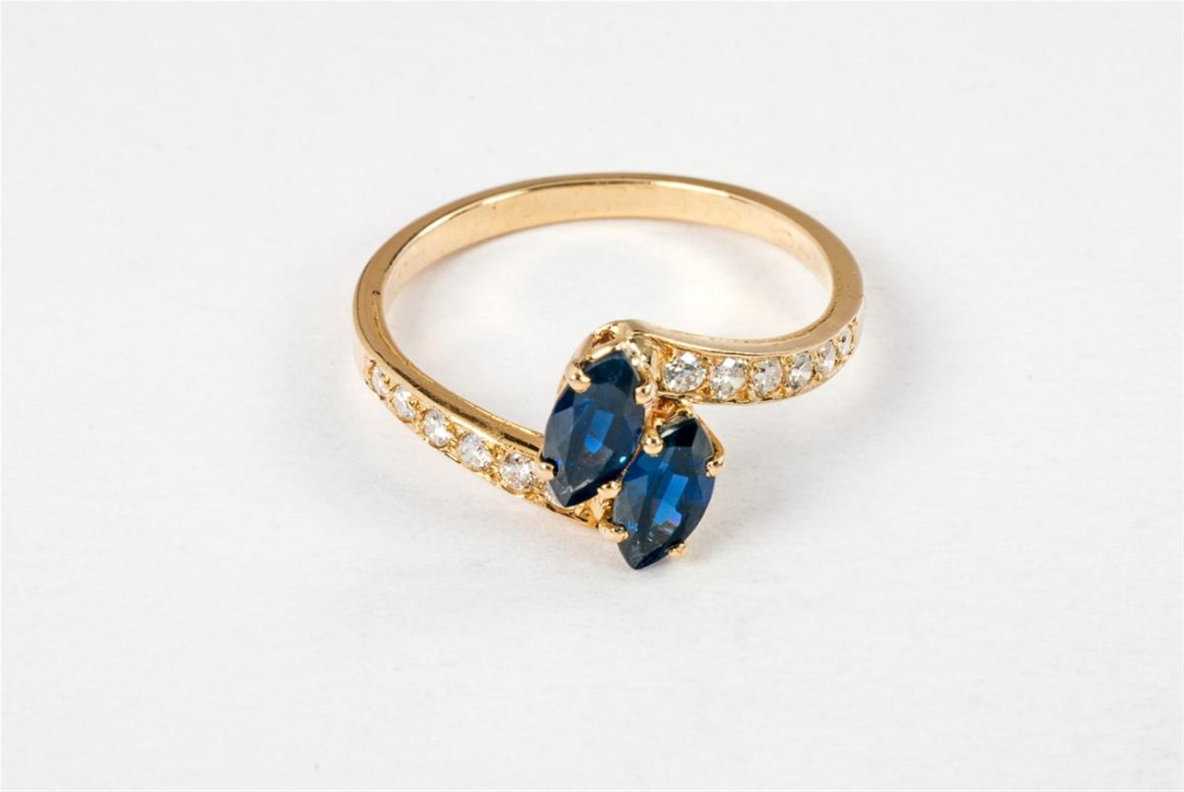 An 18 ct gold, diamond and sapphire ring by Cartier. - image-1
