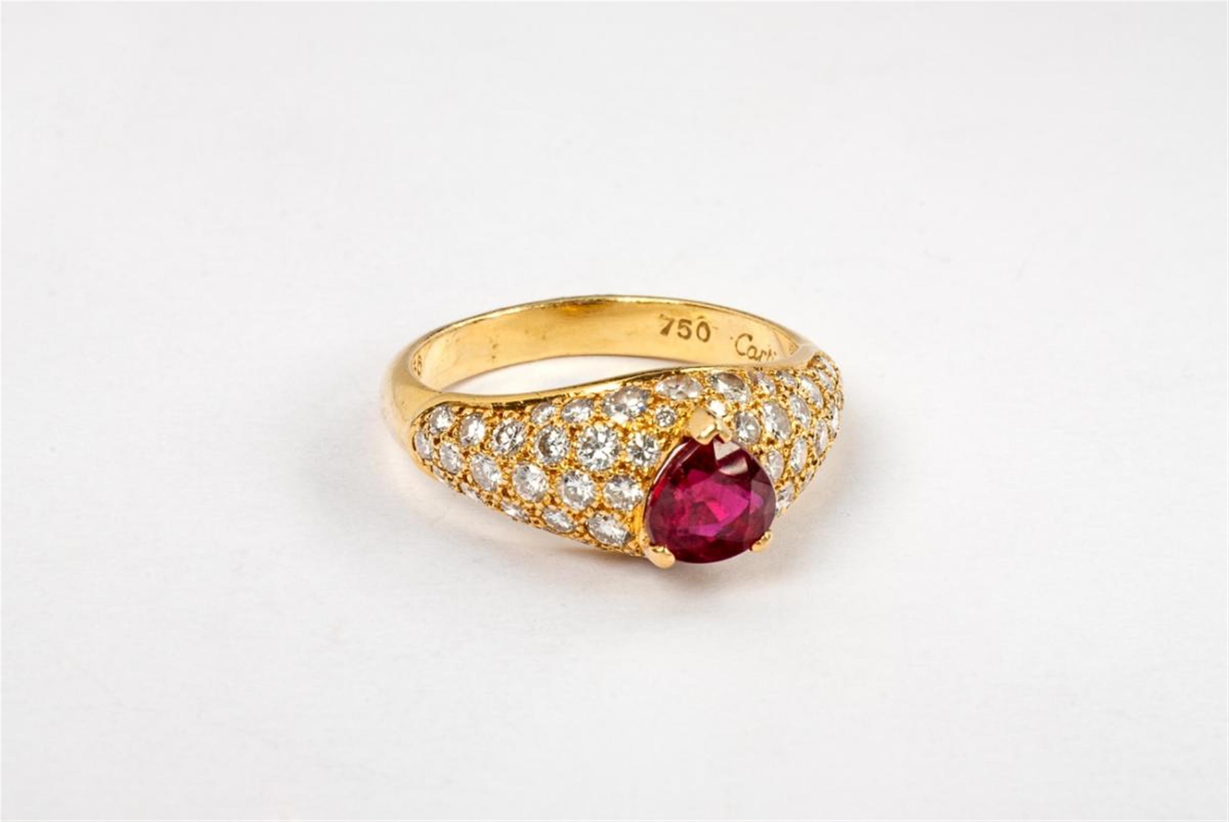 An 18 ct gold, diamond and ruby ring by Cartier. - image-1