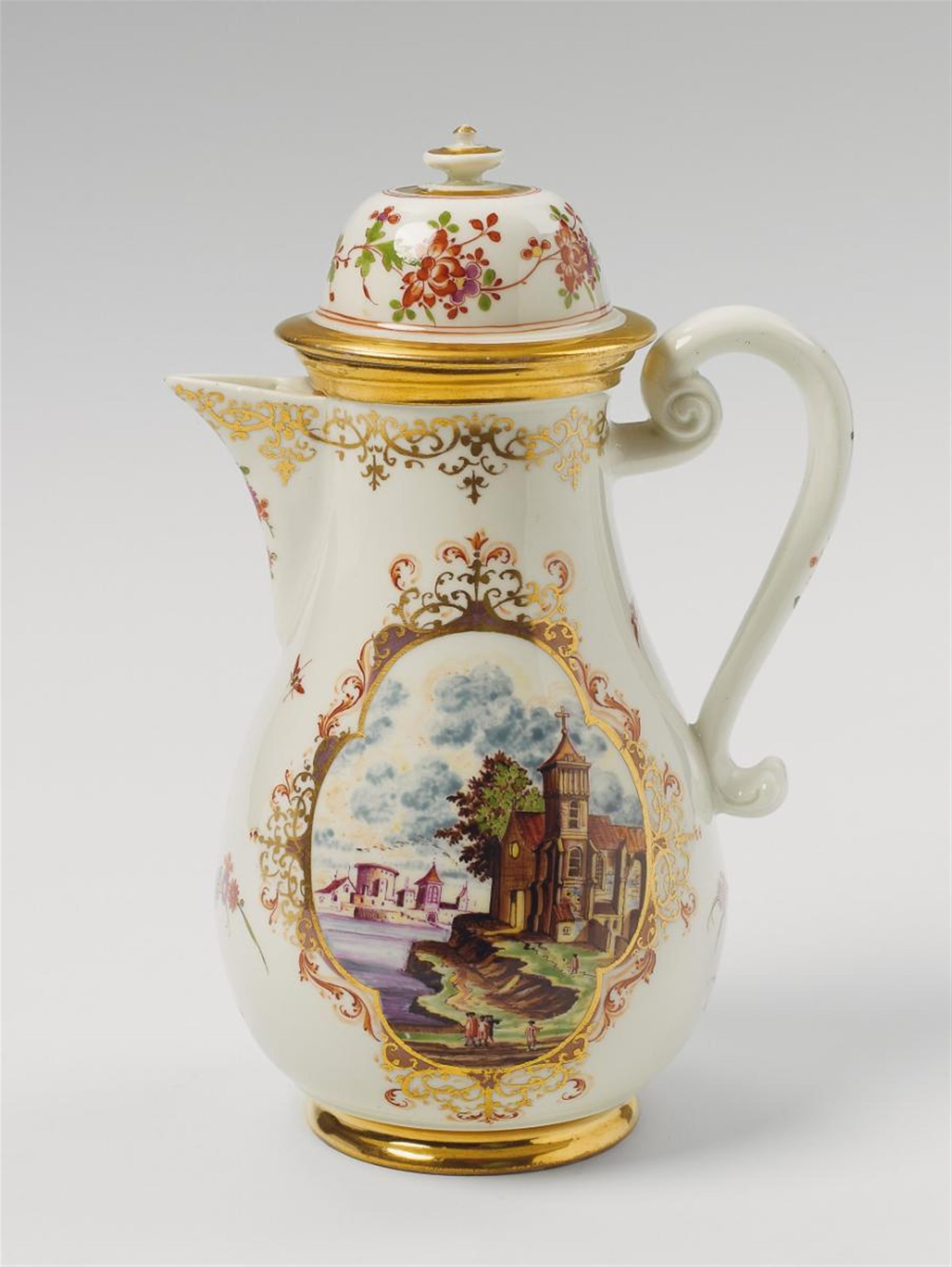 A Meissen coffee pot with delicately painted European landscapes in quatrefoil cartouches. - image-2