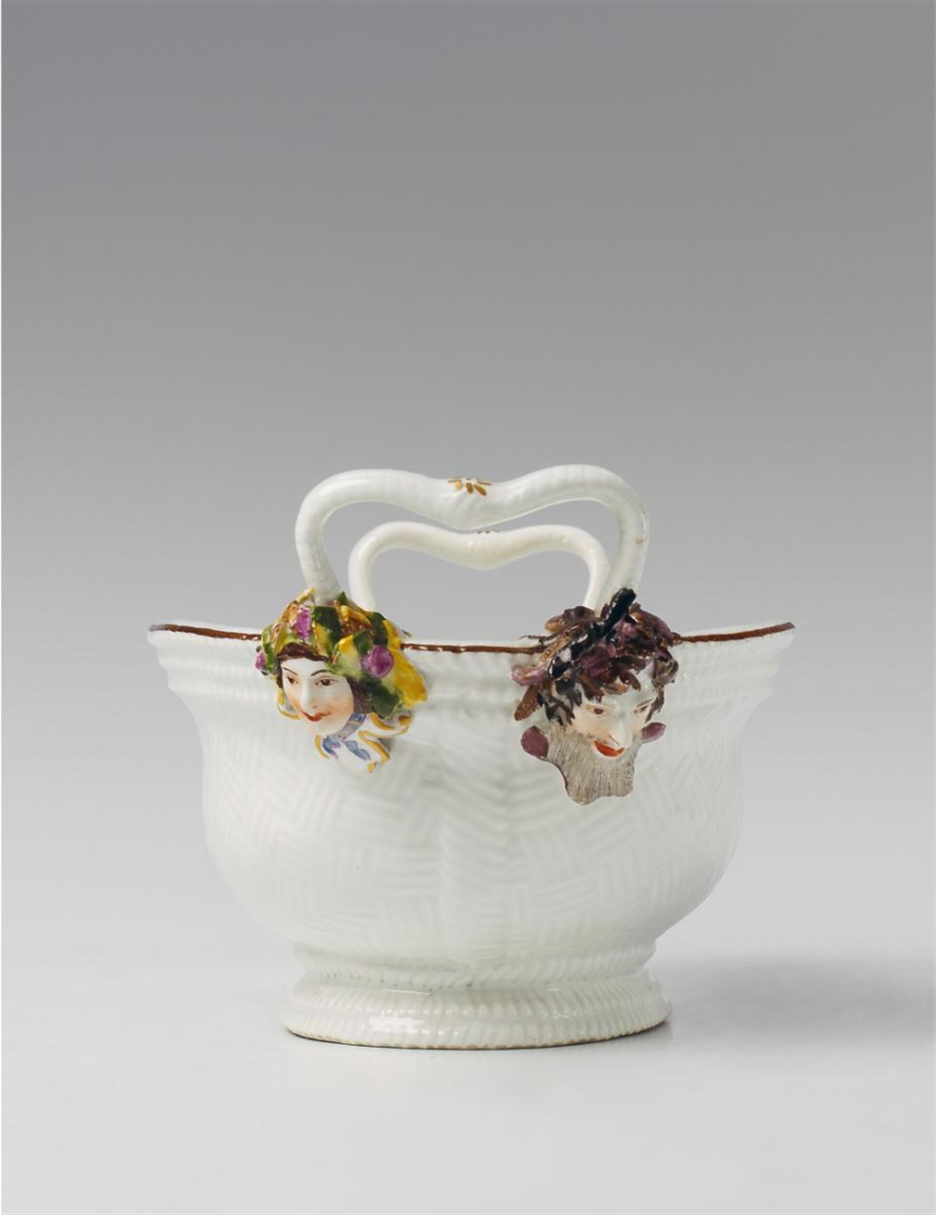 An oval Meissen basket with mascarons representing the seasons under the handles. - image-1