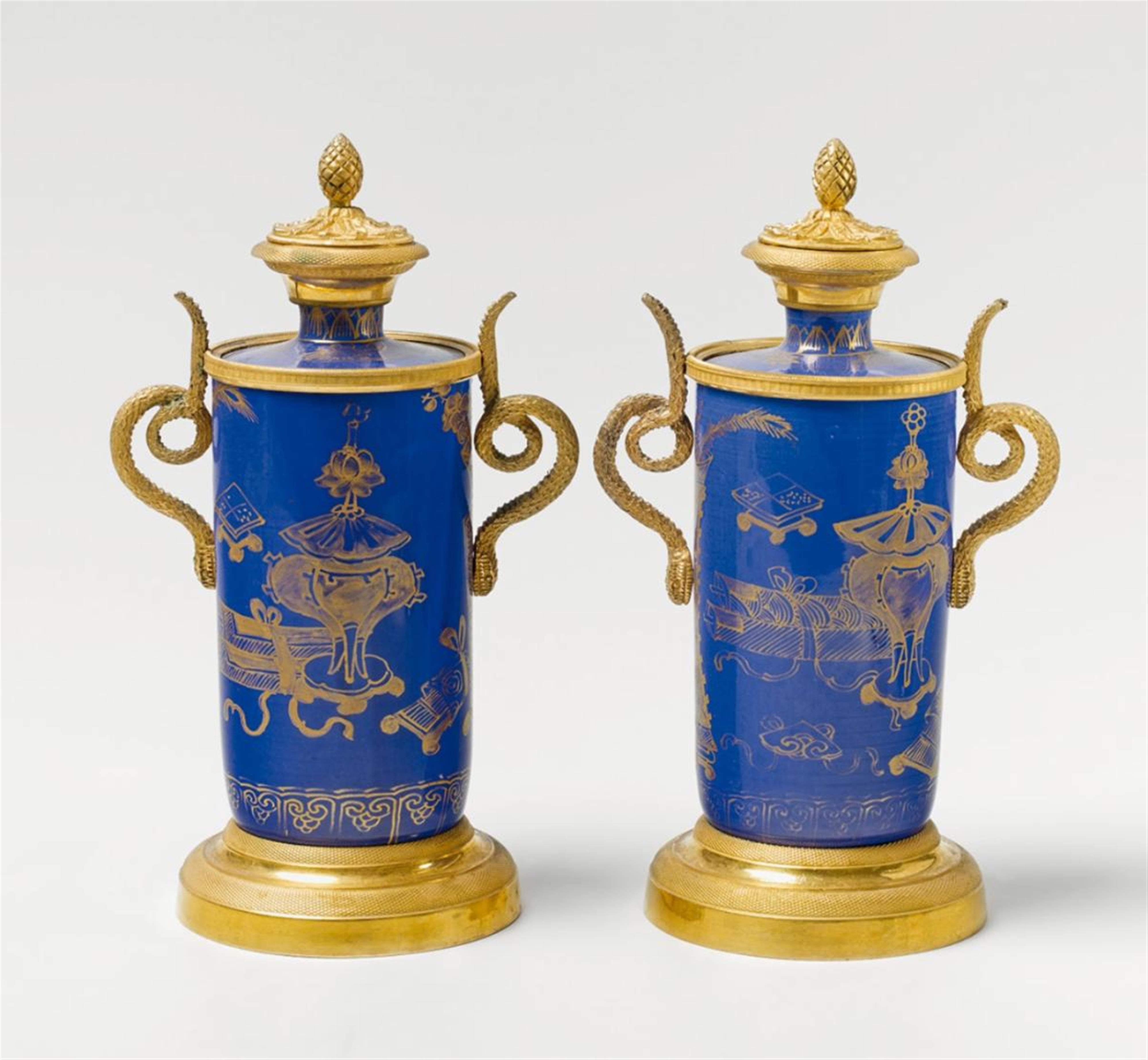 A pair of porcelain vases and covers with gilt bronze mountings - image-1