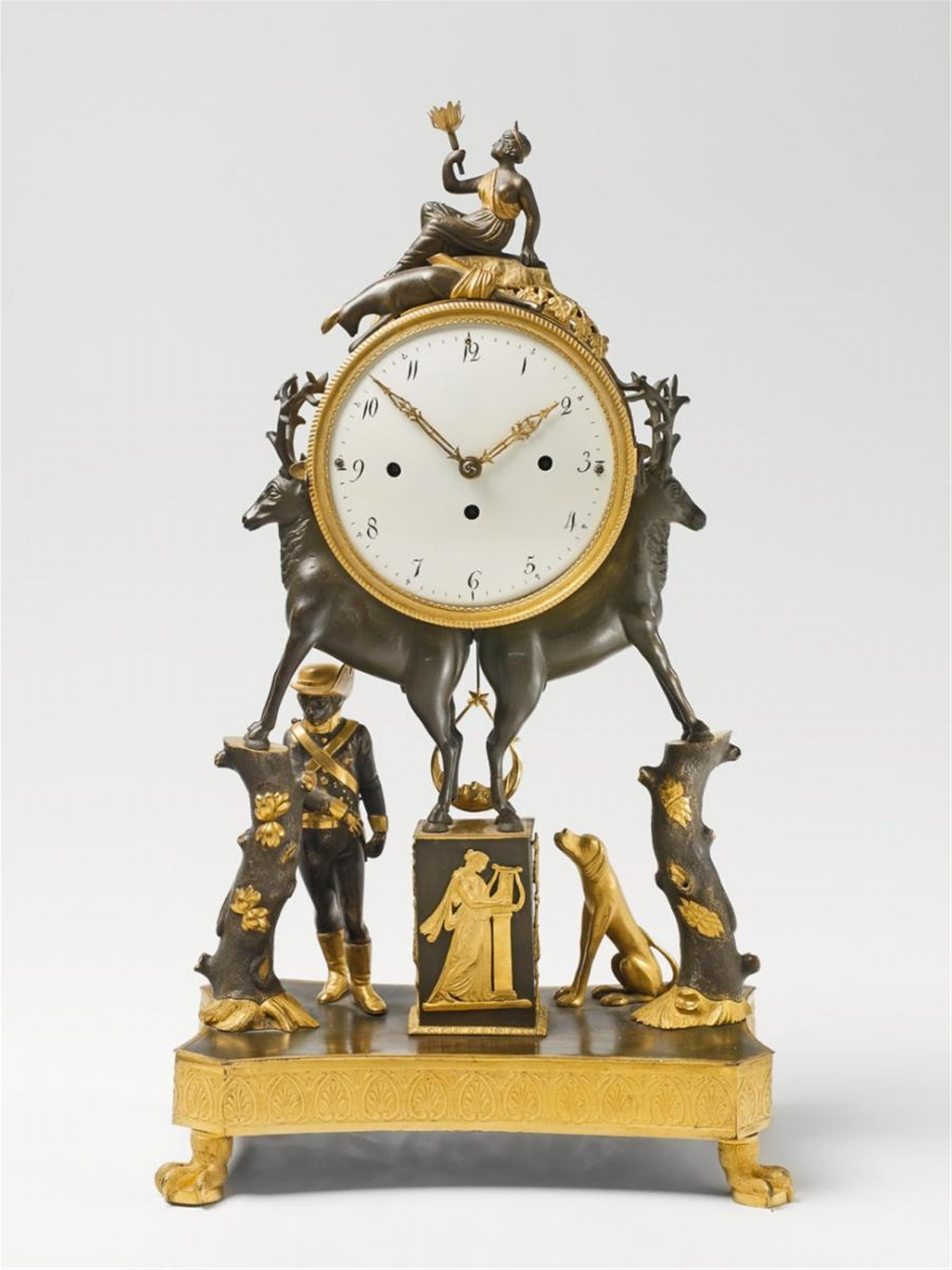 A Vienna fire-gilt bronze table clock with hunting motifs - image-1