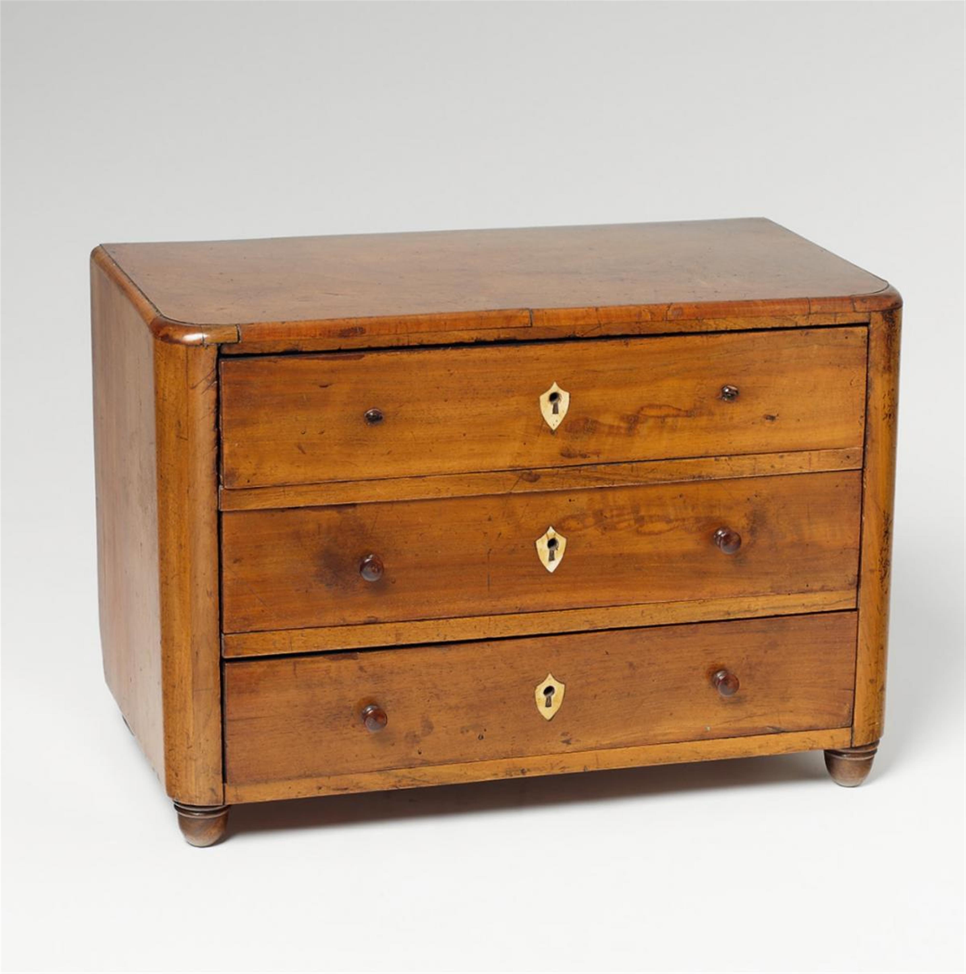 A small German Biedermeier style chest of drawers with bone inlays - image-1