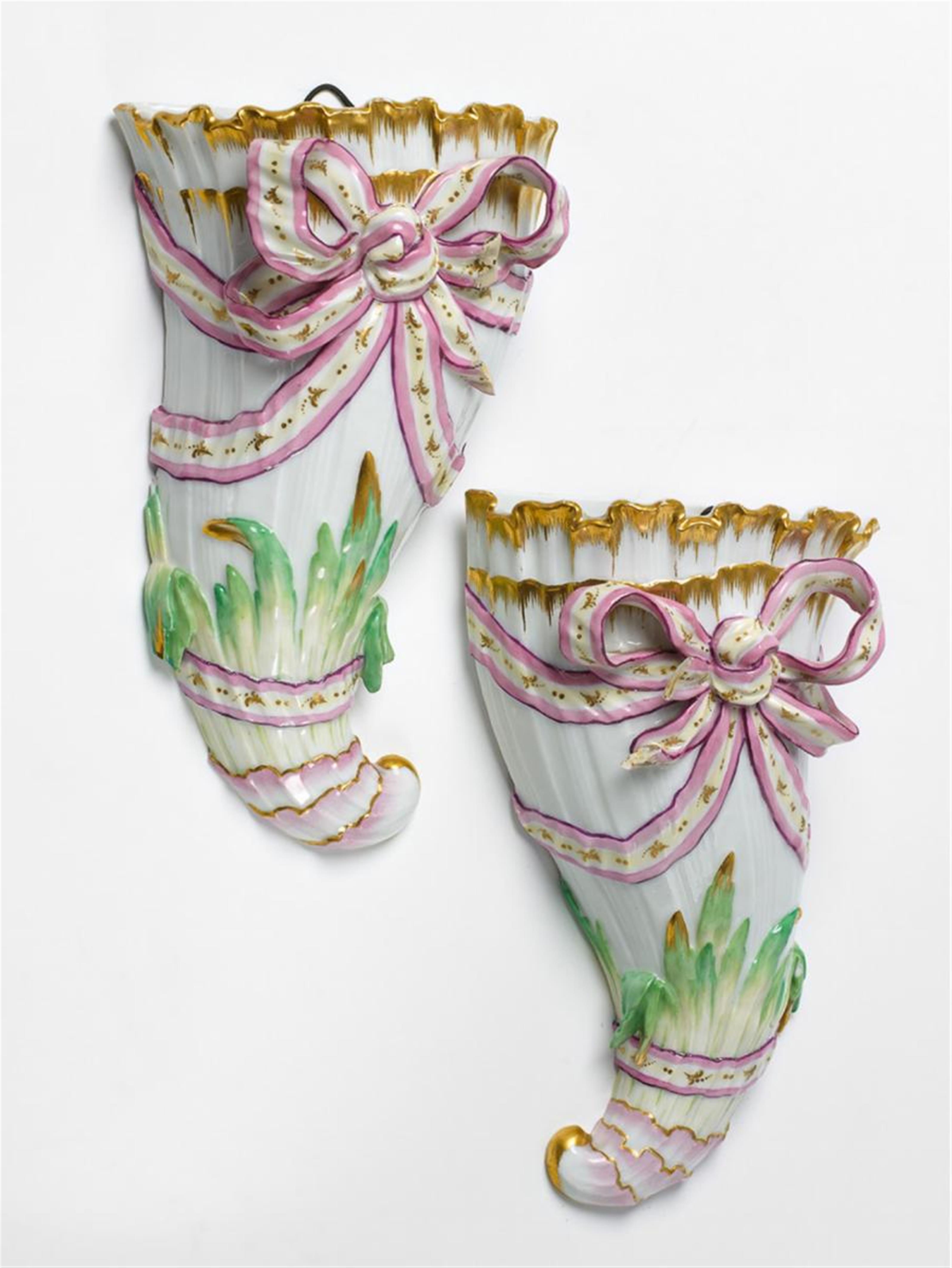 A pair of KPM porcelain wall vases formed as cornucopias. - image-1