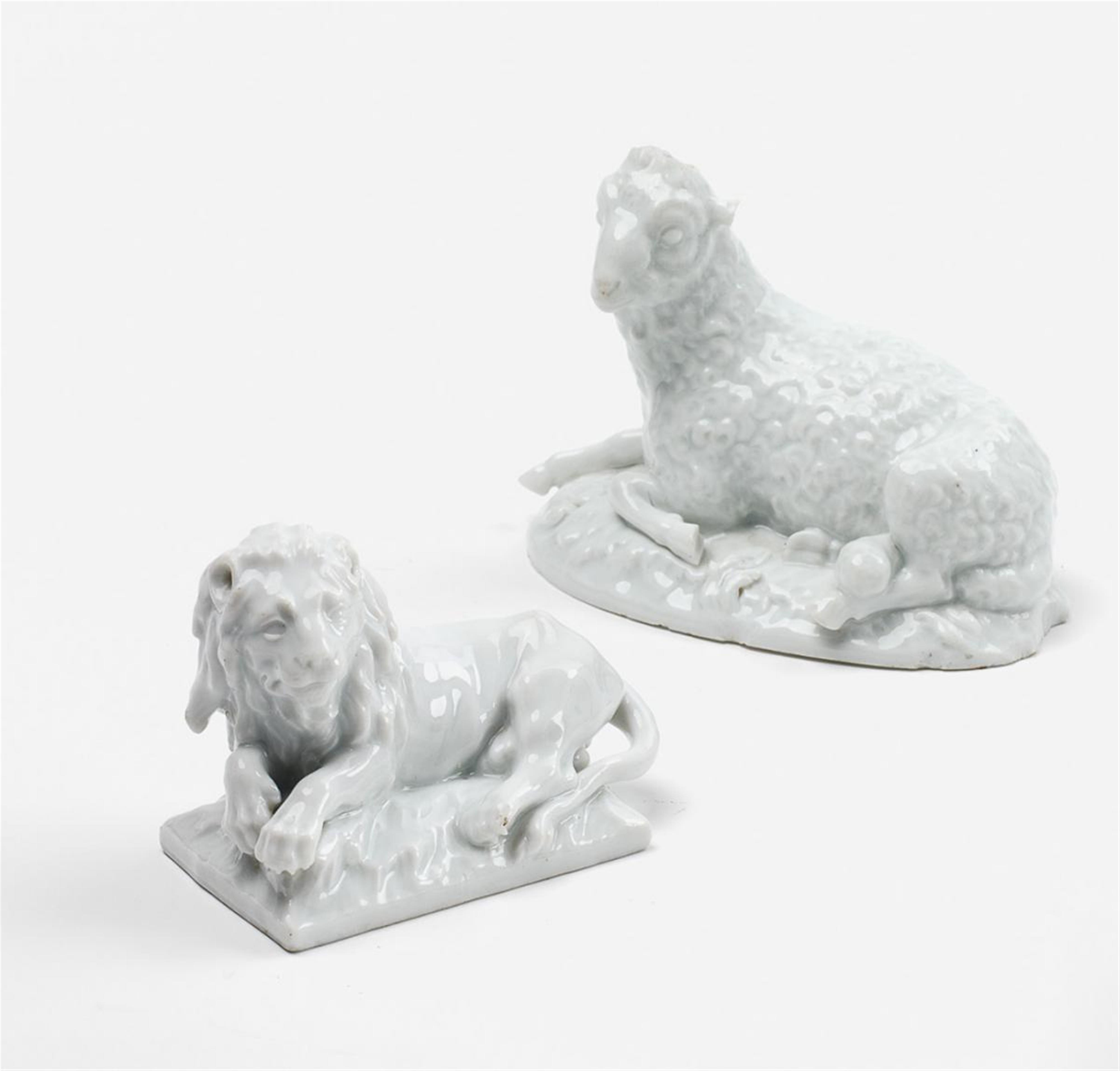 Two KPM porcelain figures of a lion and a ram. - image-1