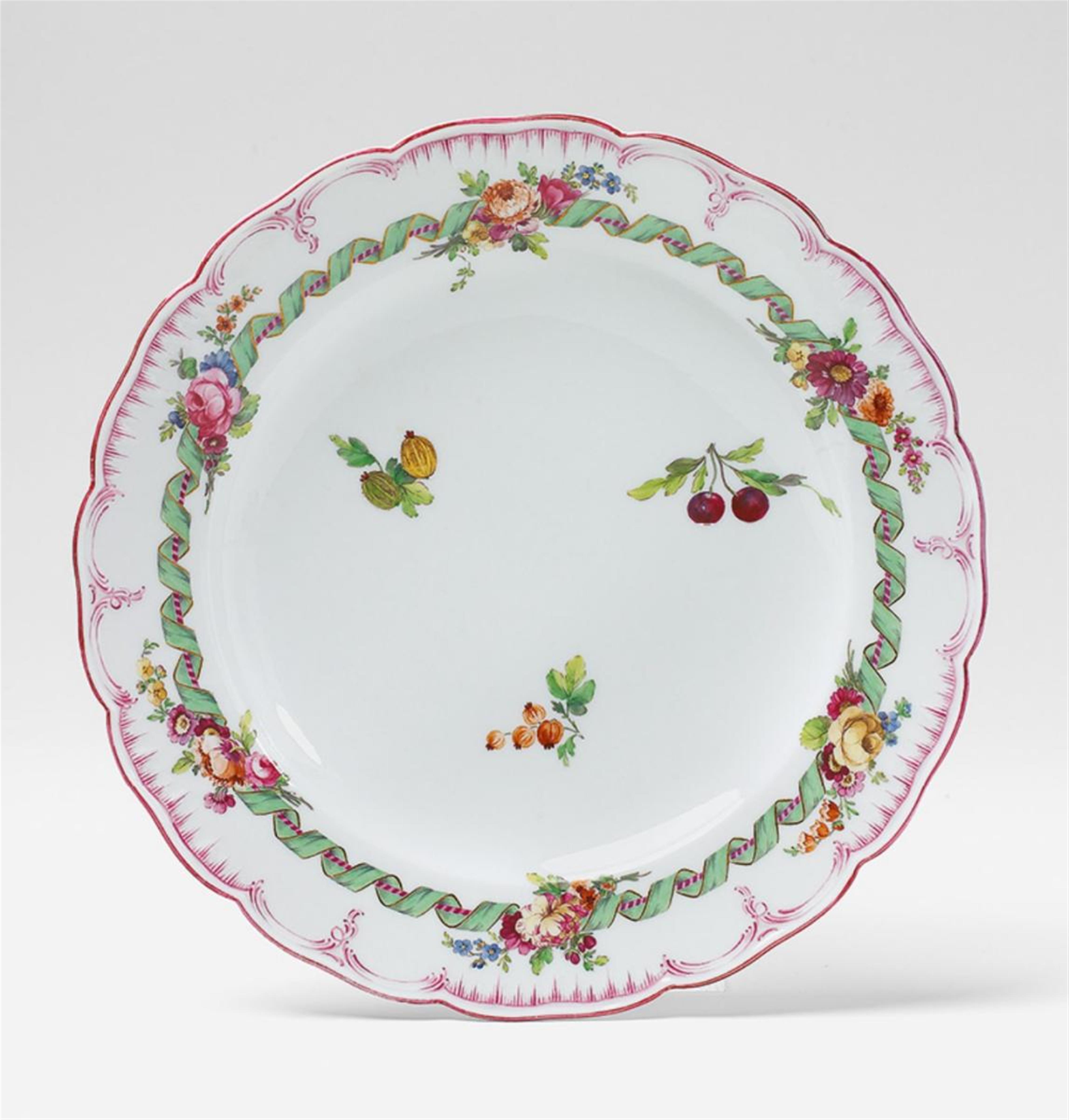 A KPM porcelain plate with floral decor. - image-1