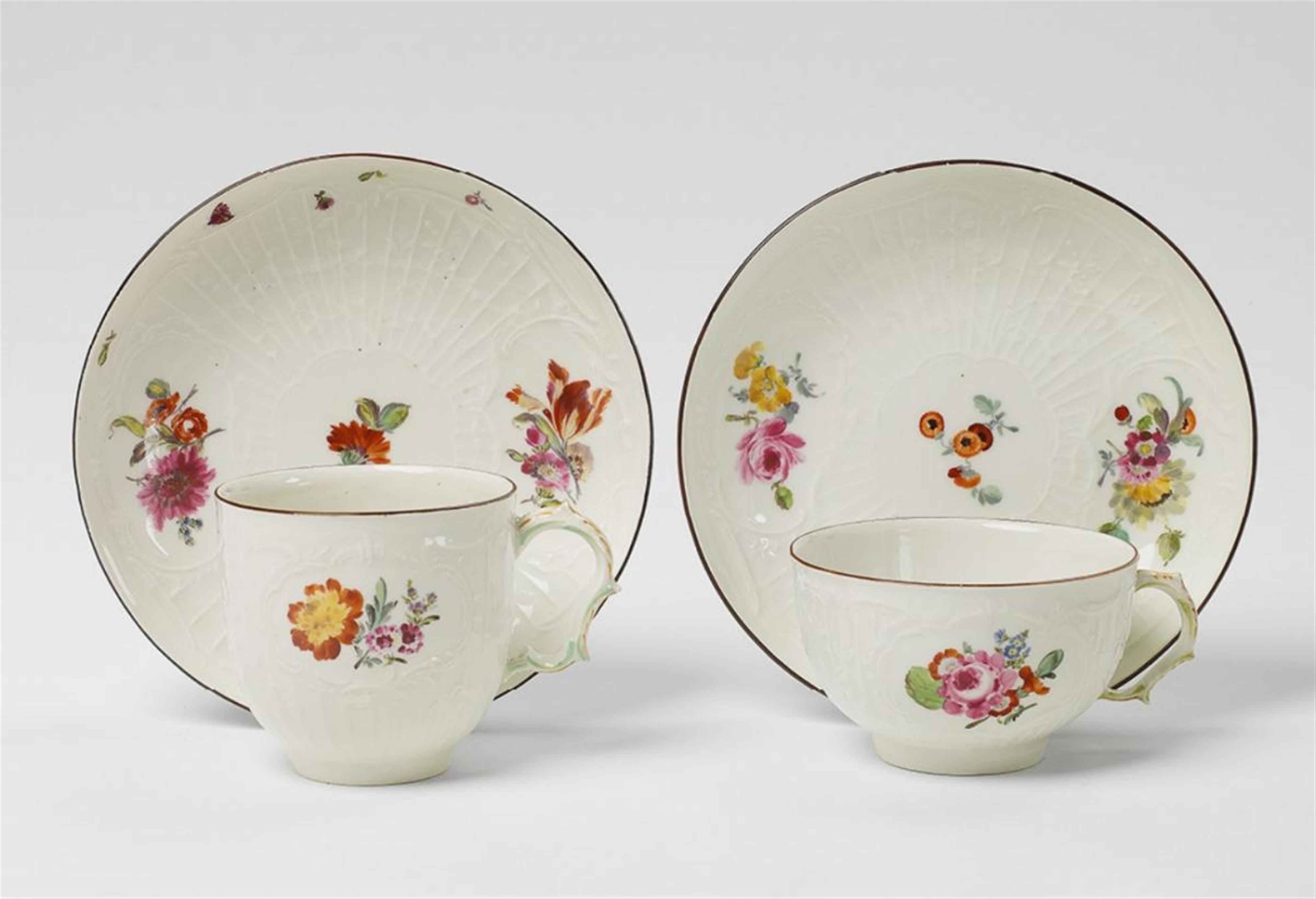 A KPM porcelain tea and coffee cup with deutsche blumen. - image-1