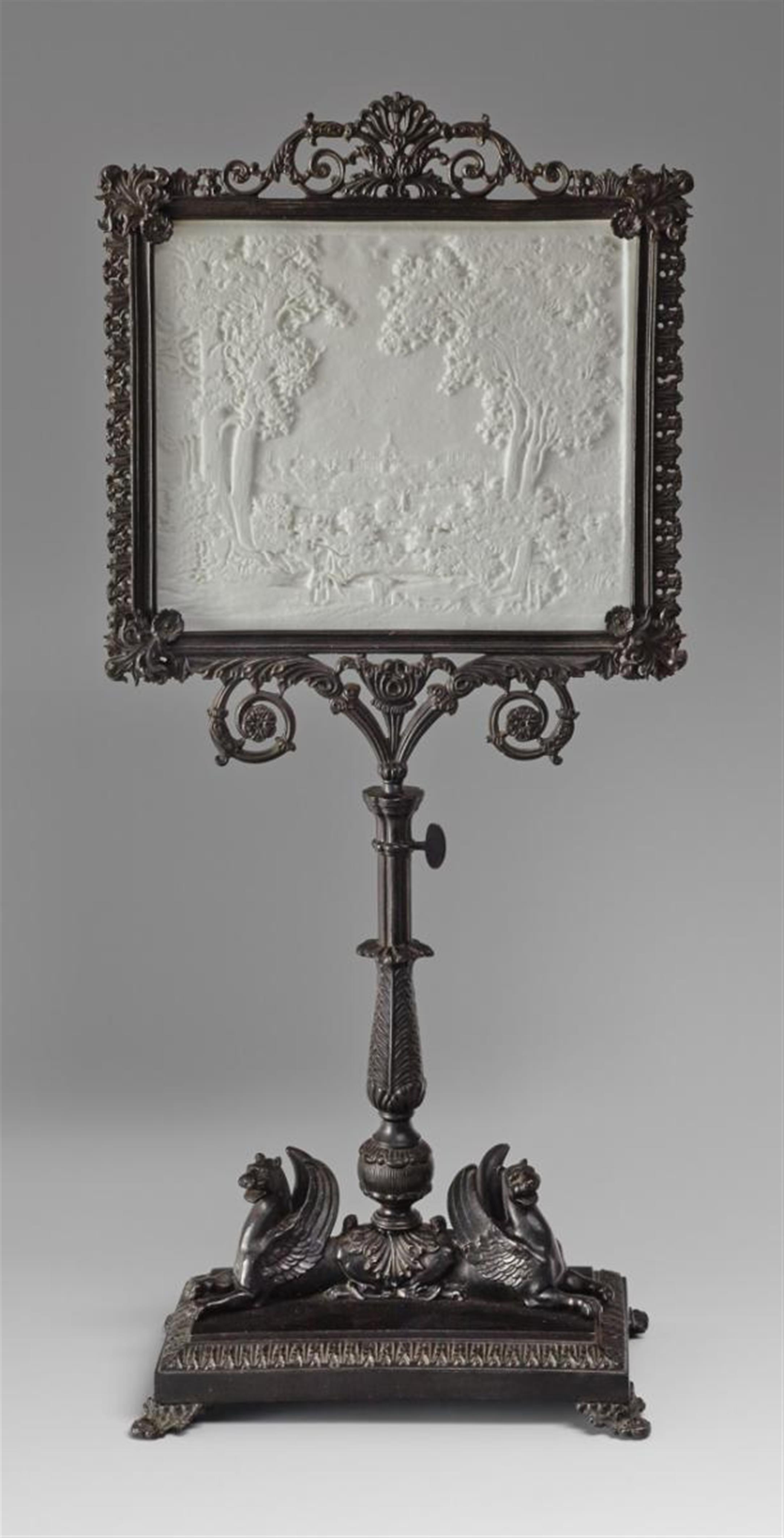 A KPM porcelain lithophane in a neoclassical cast iron stand. - image-1