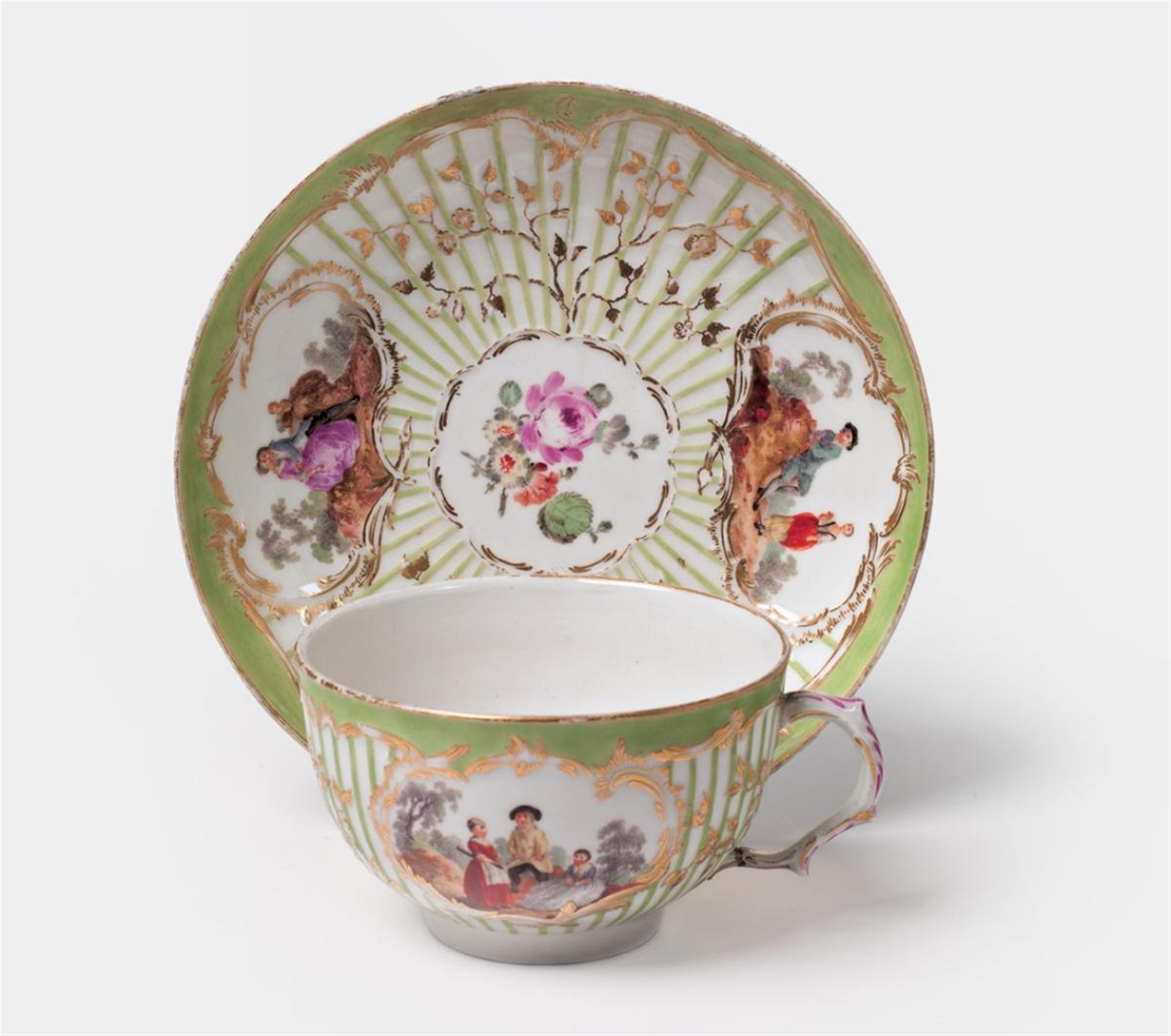 A KPM porcelain teacup with scenes after Watteau. - image-1