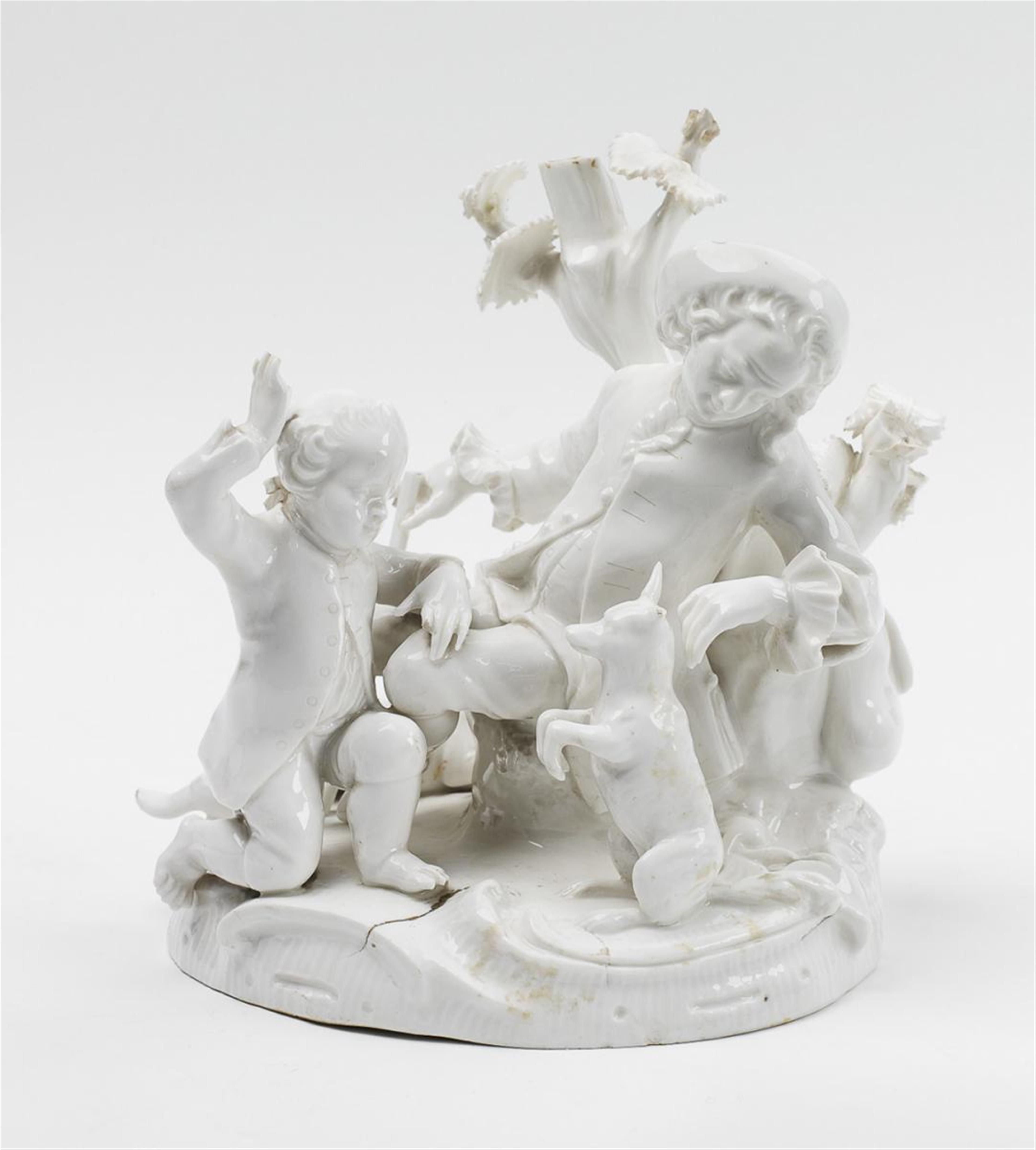A Wegely porcelain figure of a courtly gentleman with a boy and a dog. - image-1