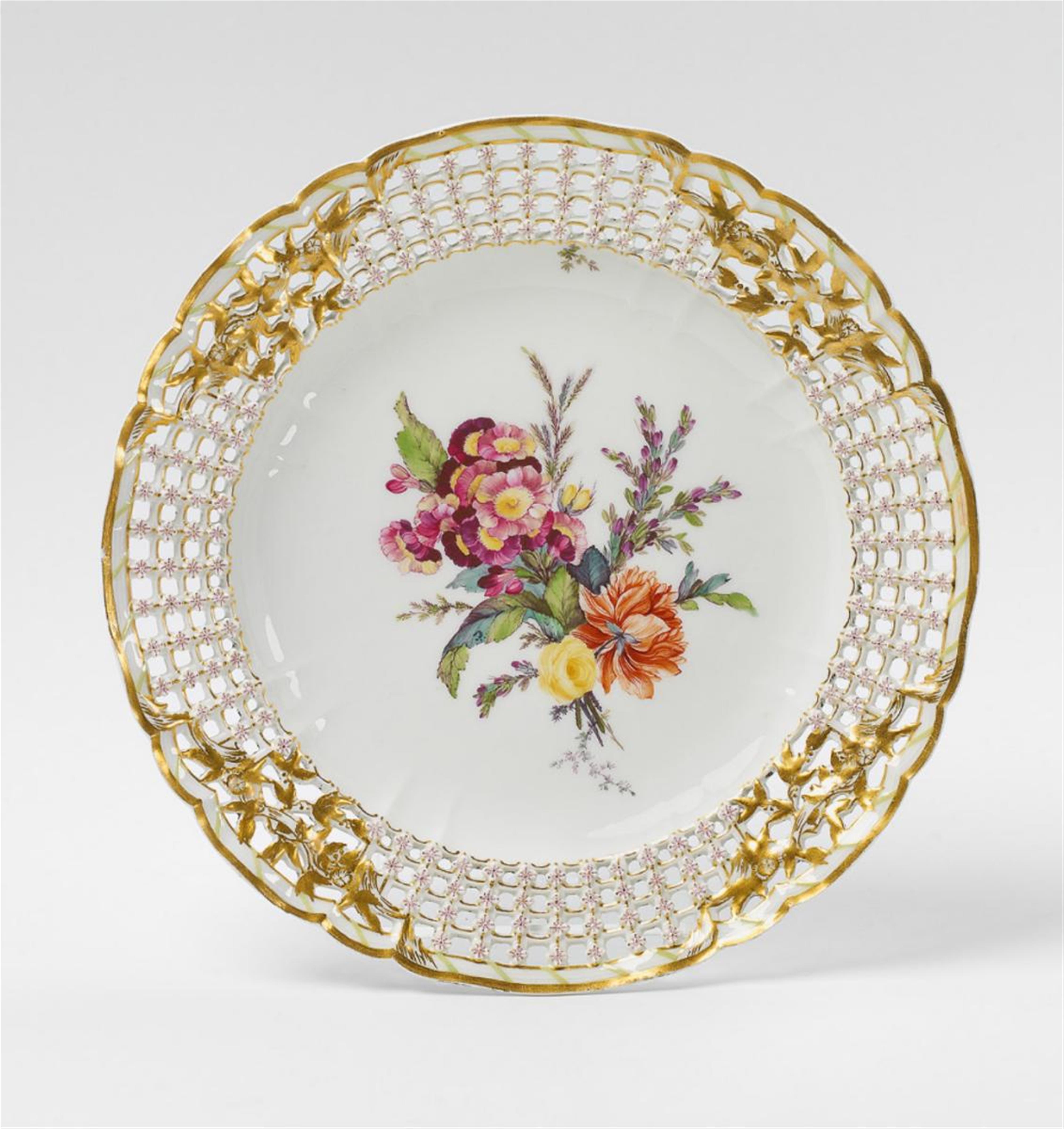 A KPM porcelain dessert plate with floral decor. - image-1