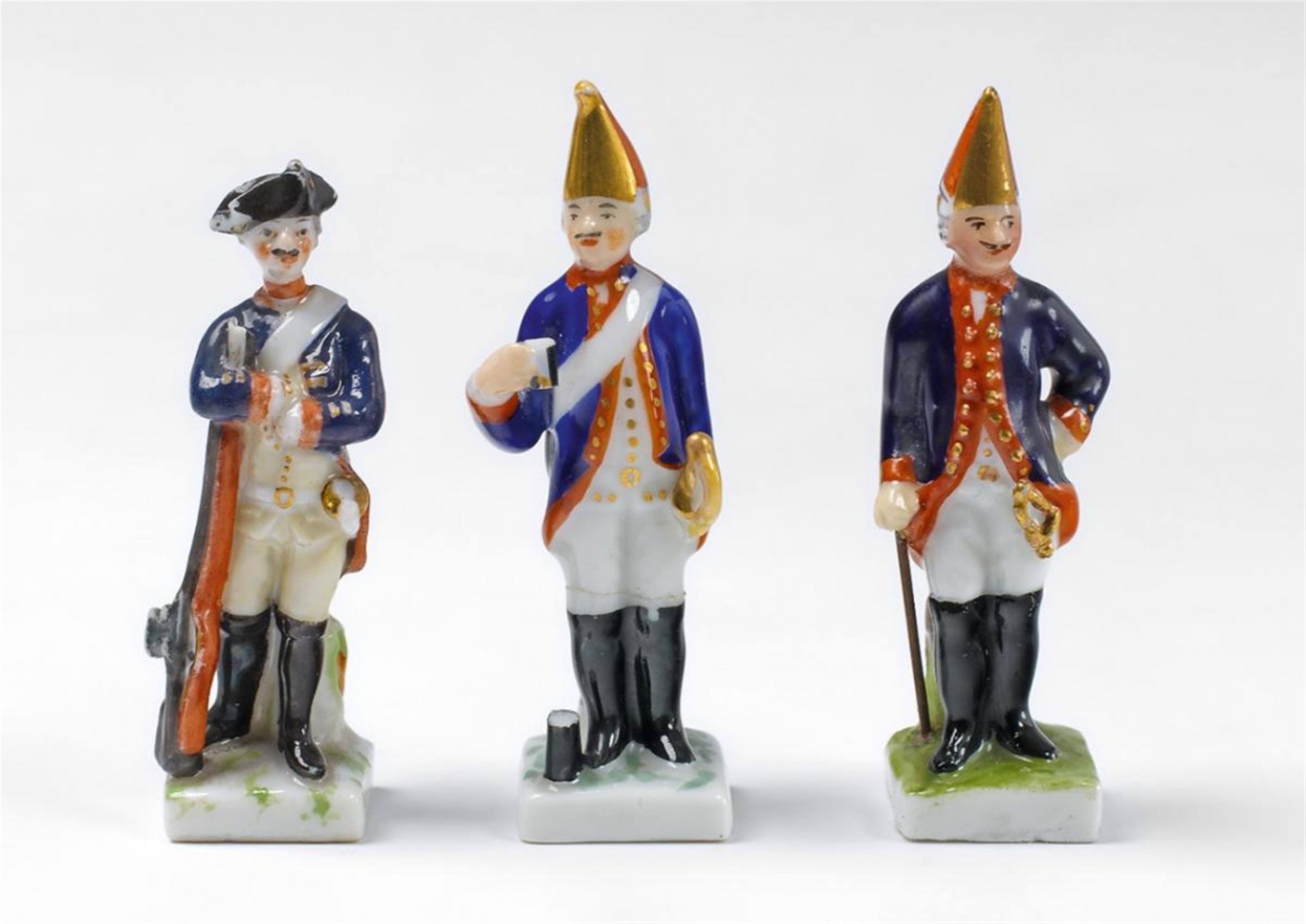 Three KPM miniature porcelain soldiers. - image-1