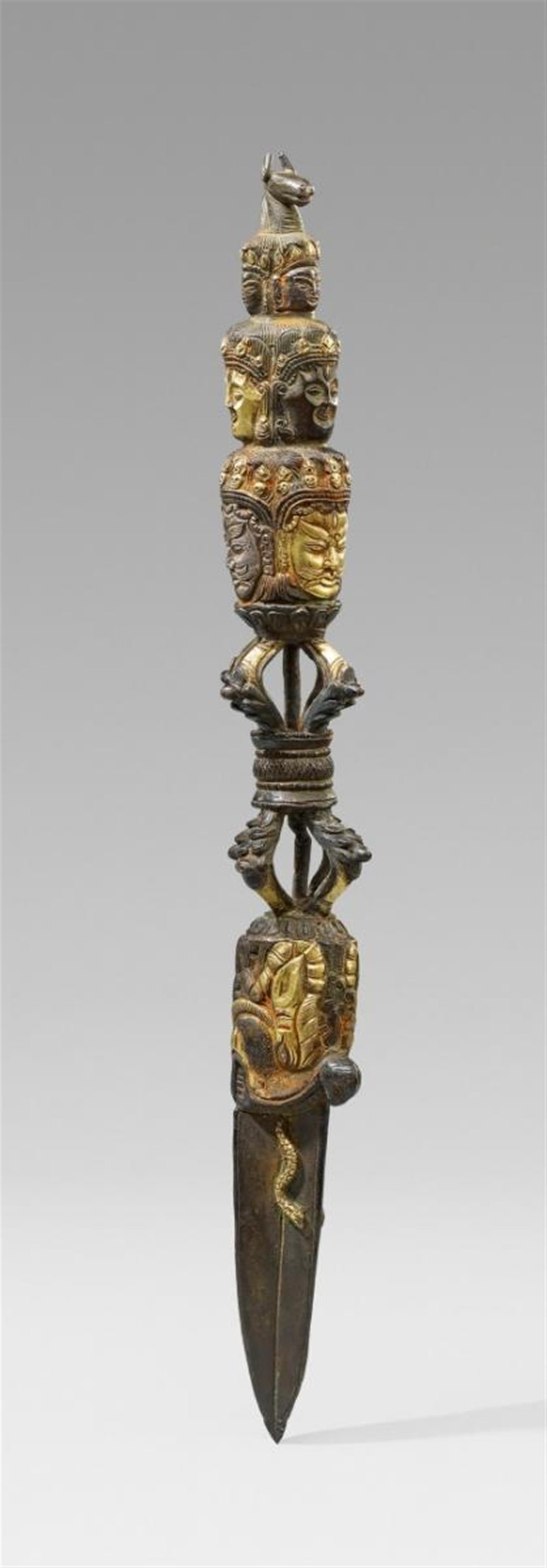 A partially gilt and silver-plated bronze ritual dagger. Tibet - image-1