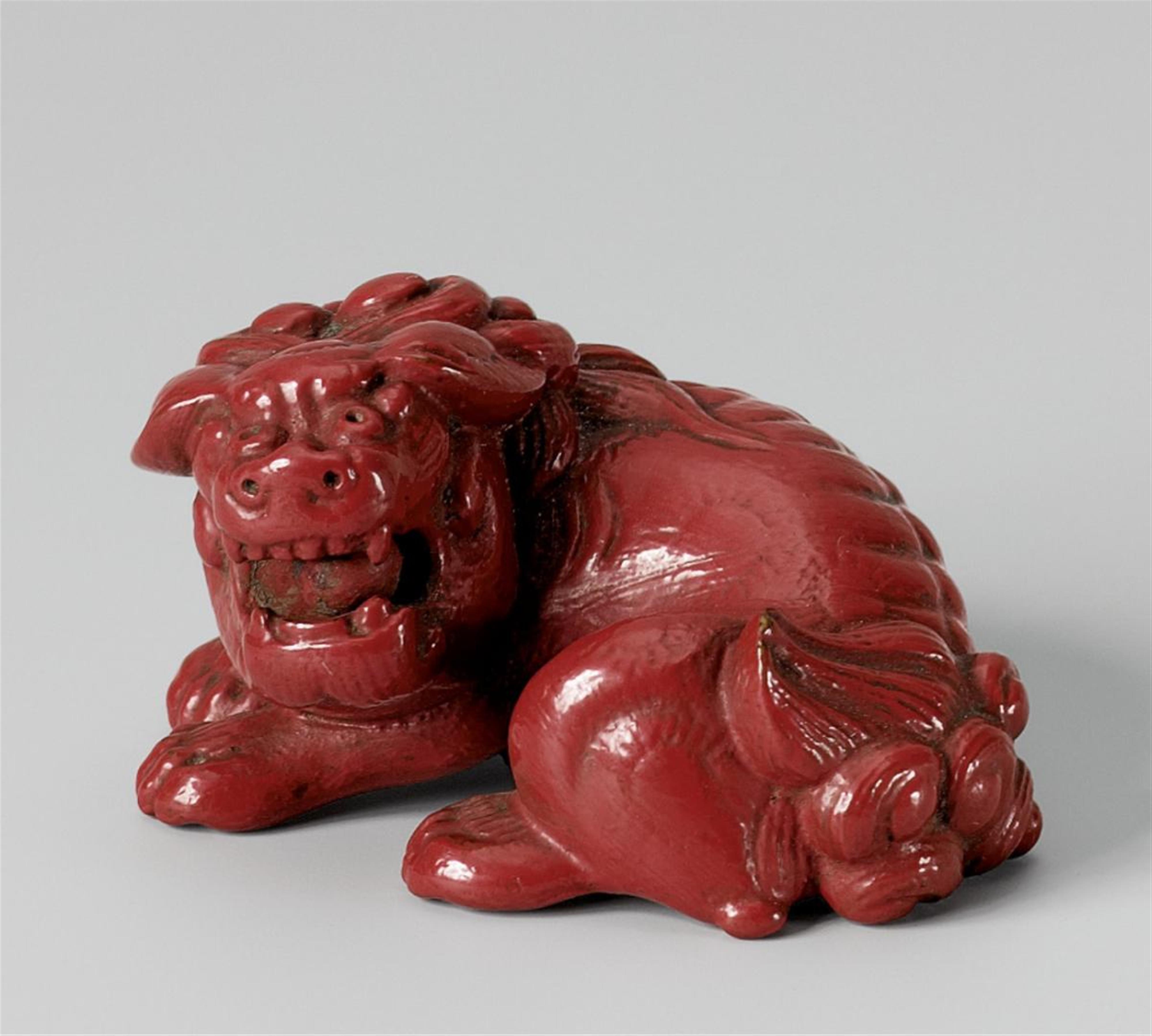 A red lacquer netsuke of a shishi. 19th century - image-1