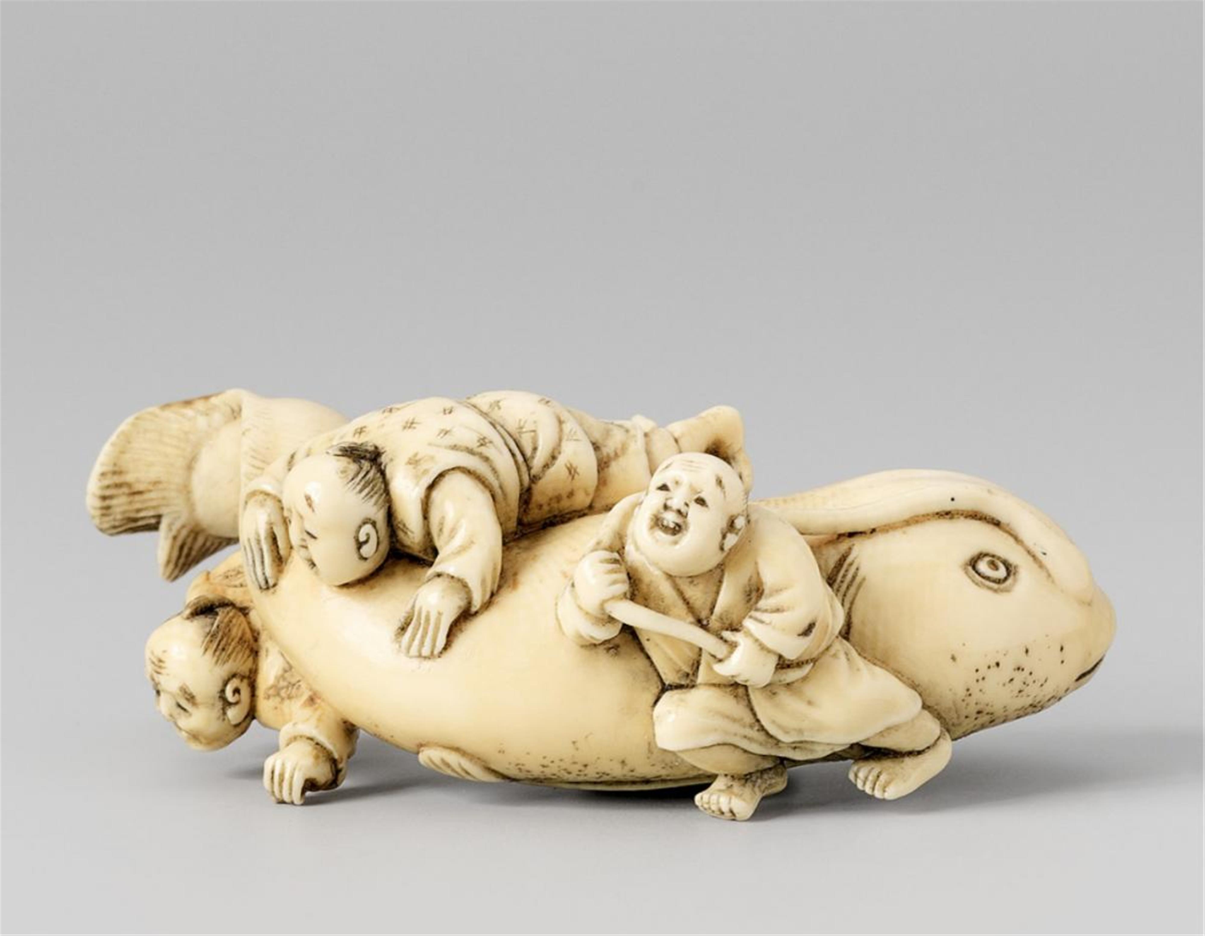 An ivory netsuke of the mythical giant catfish (namazu). Late 19th century - image-1
