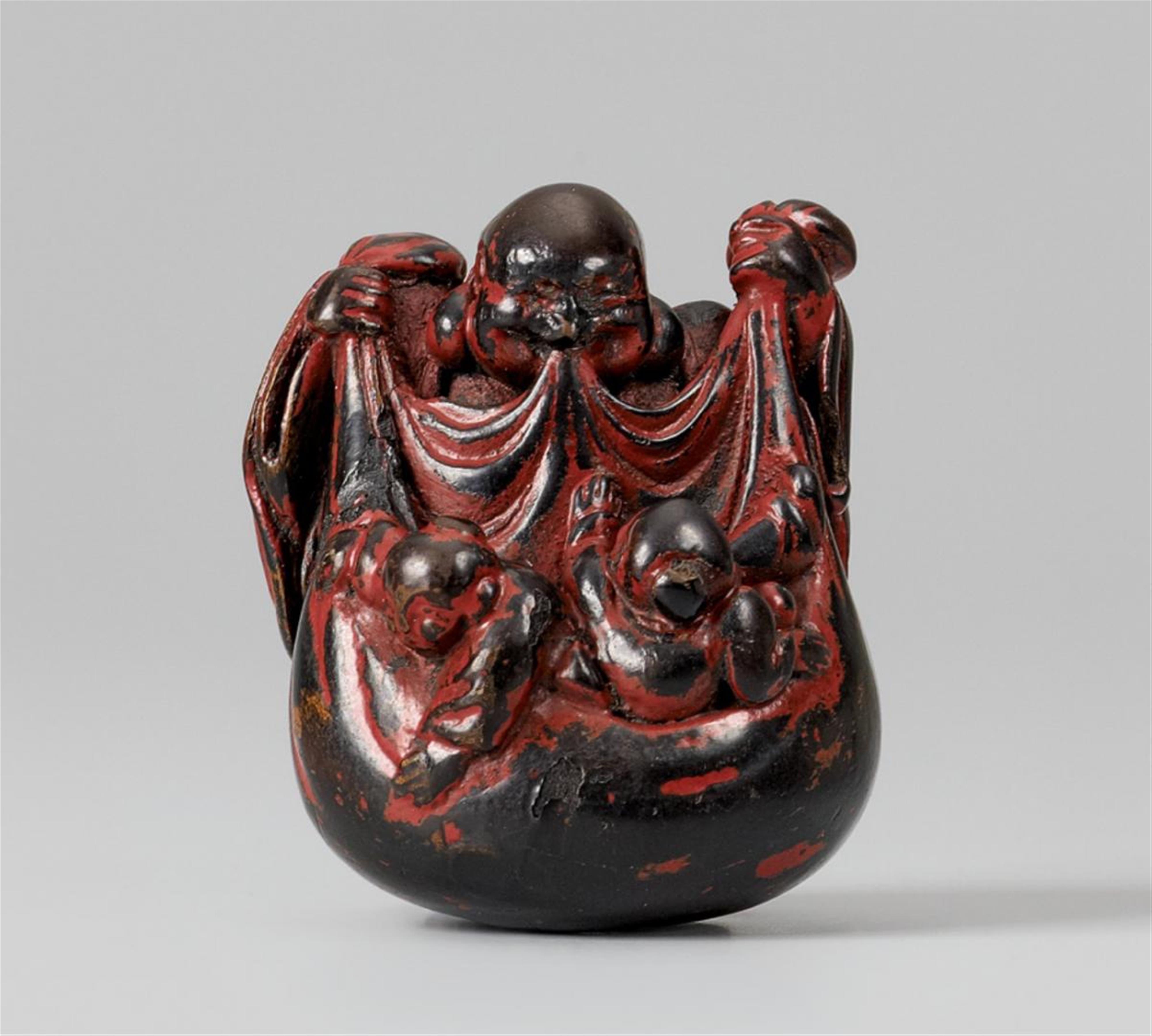 A lacquered wood netsuke of Hotei with two karako. 19th century - image-1