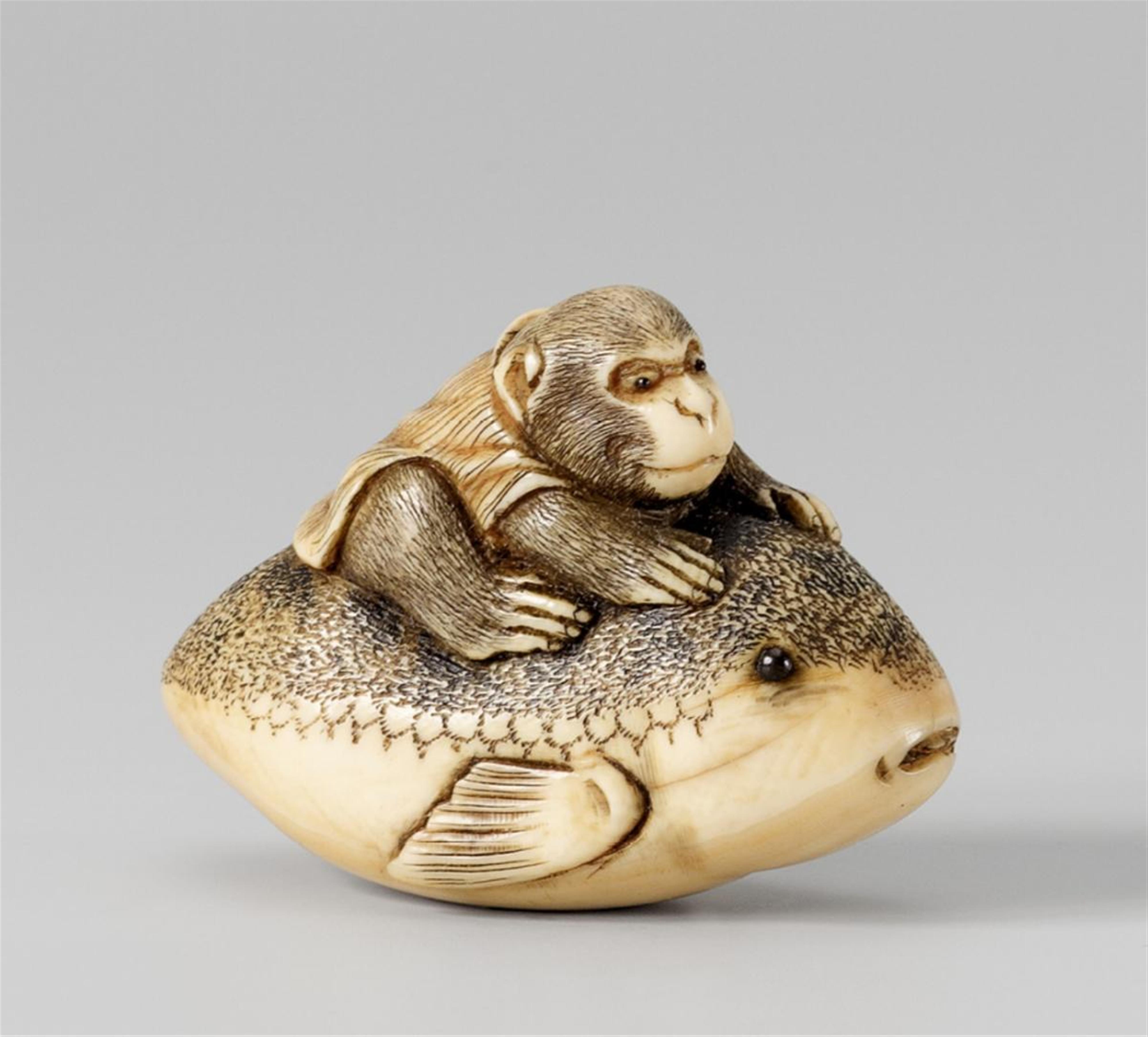 An ivory netsuke of a monkey on a fugu. 19th century - image-1
