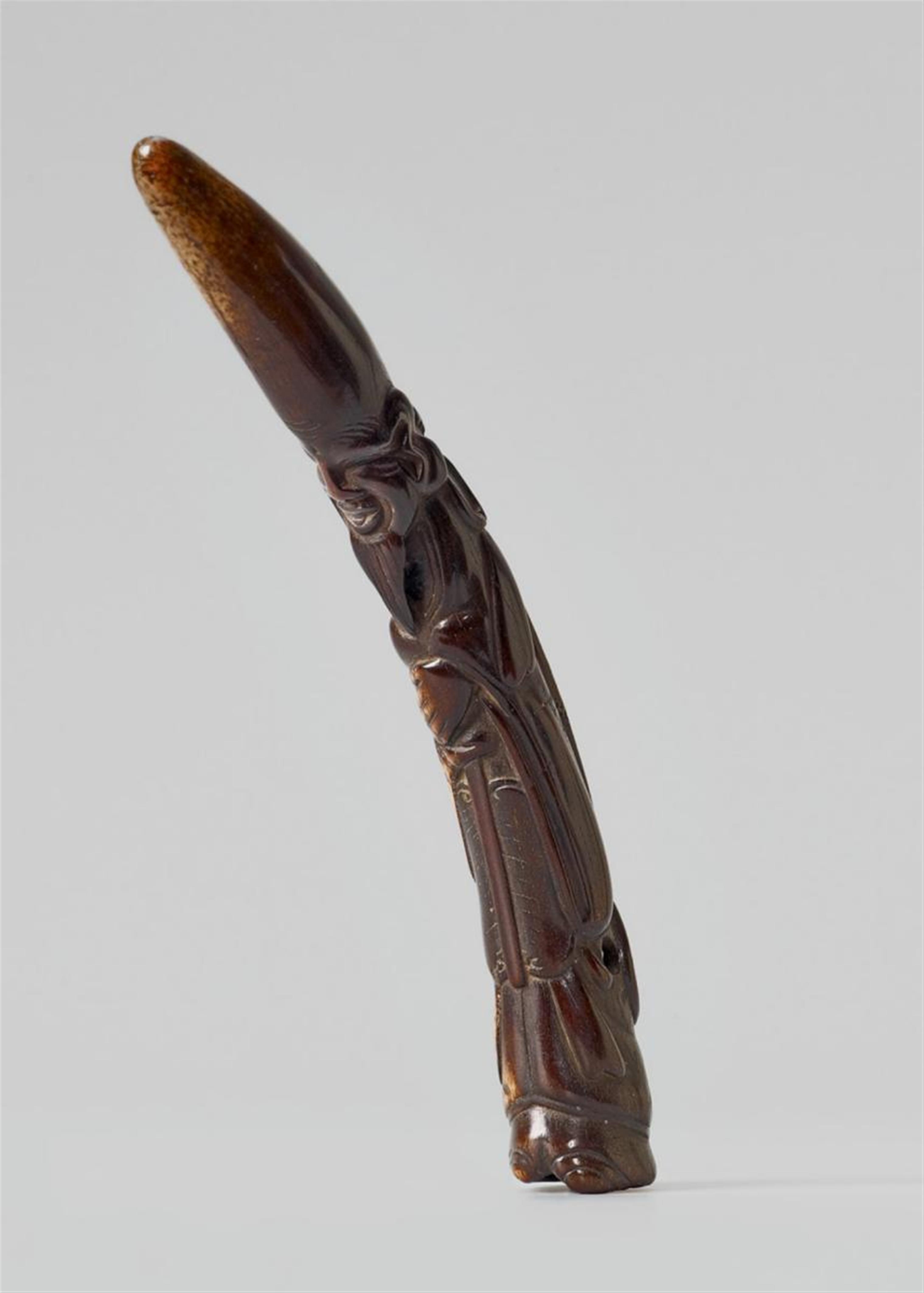 A long stained stag antler netsuke of Fukurokuju. - image-1