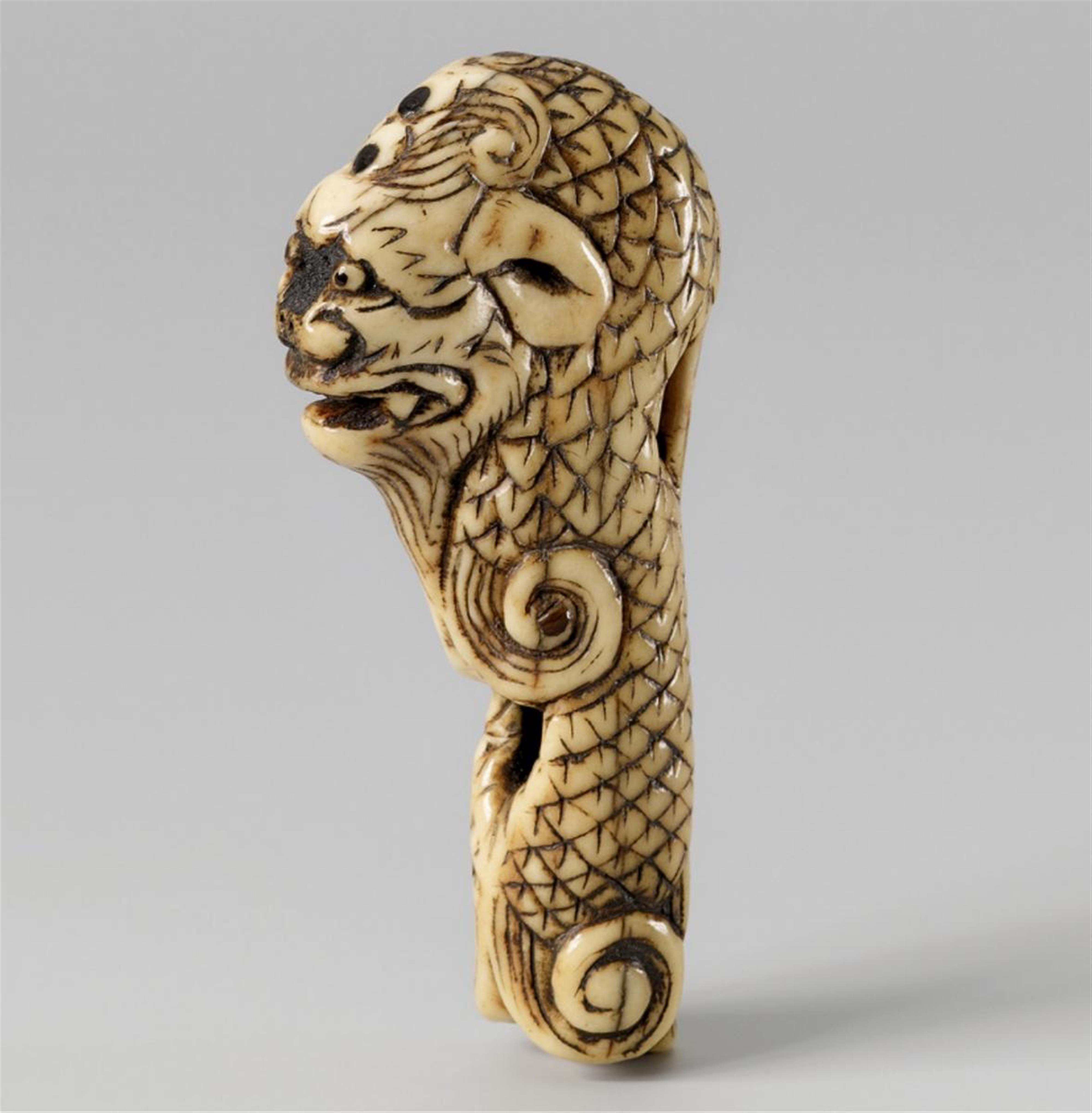 An unusual stag antler netsuke of a dragon. 19th century - image-1