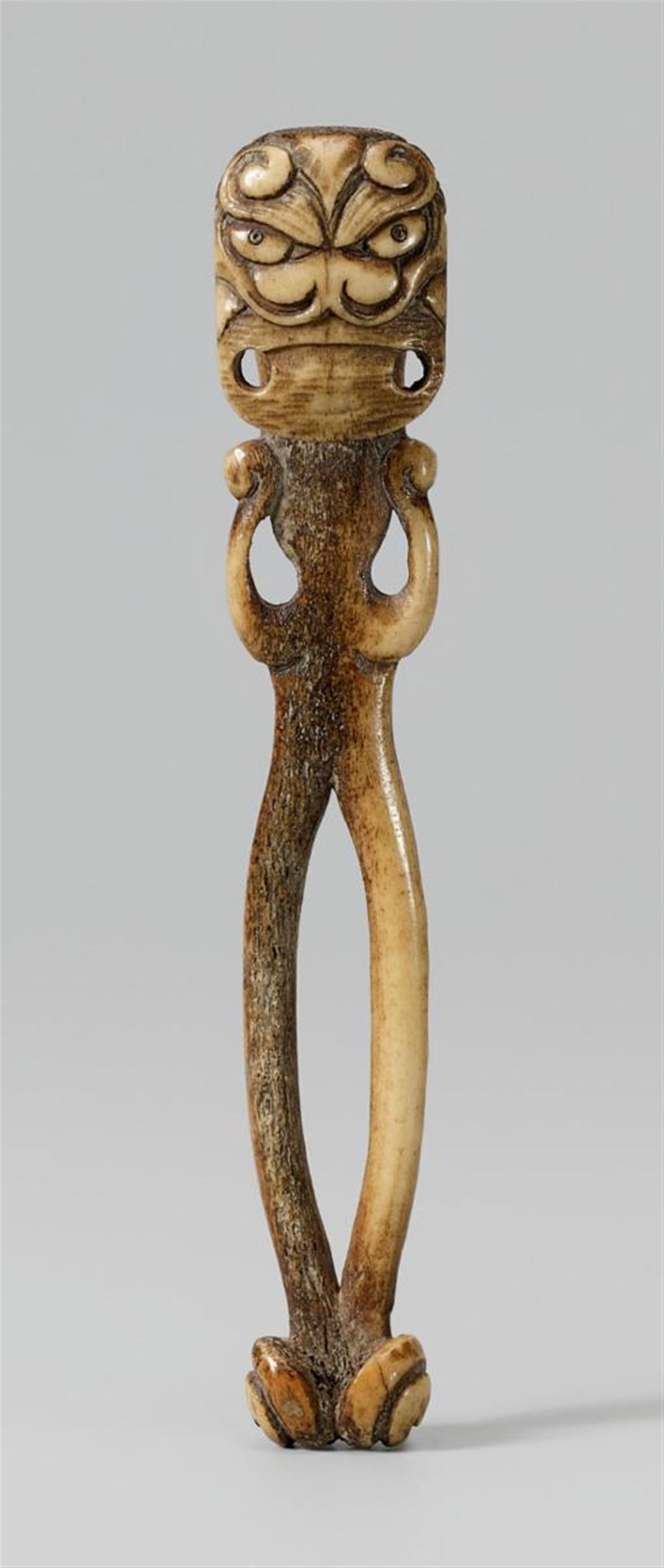 A stag antler obi hasami netsuke of an oni. Second half 19th century - image-1