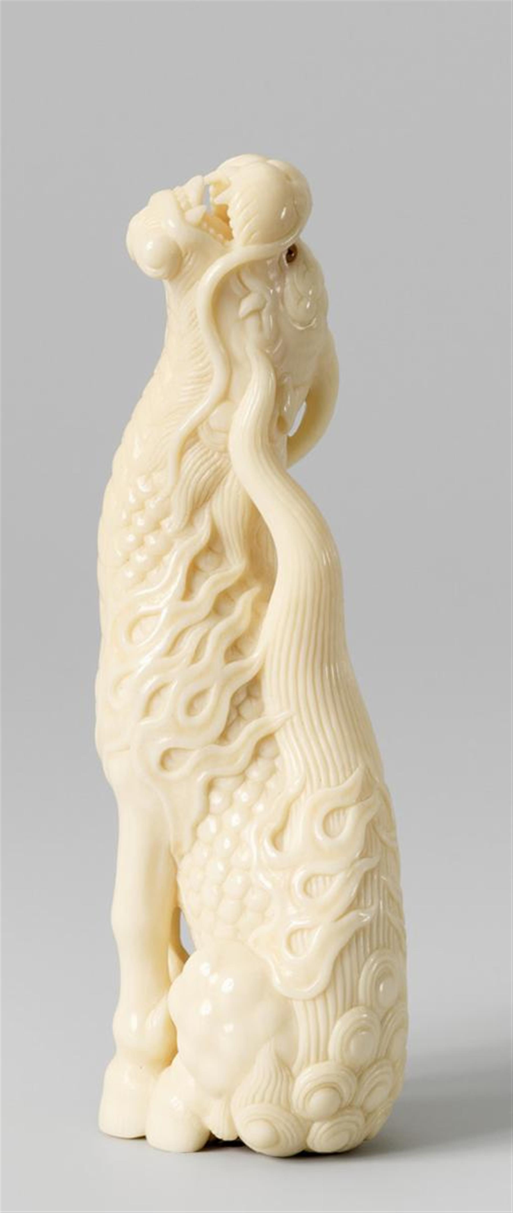 A very large ivory netsuke of a kirin, by Kangyoku. Late 20th century - image-1