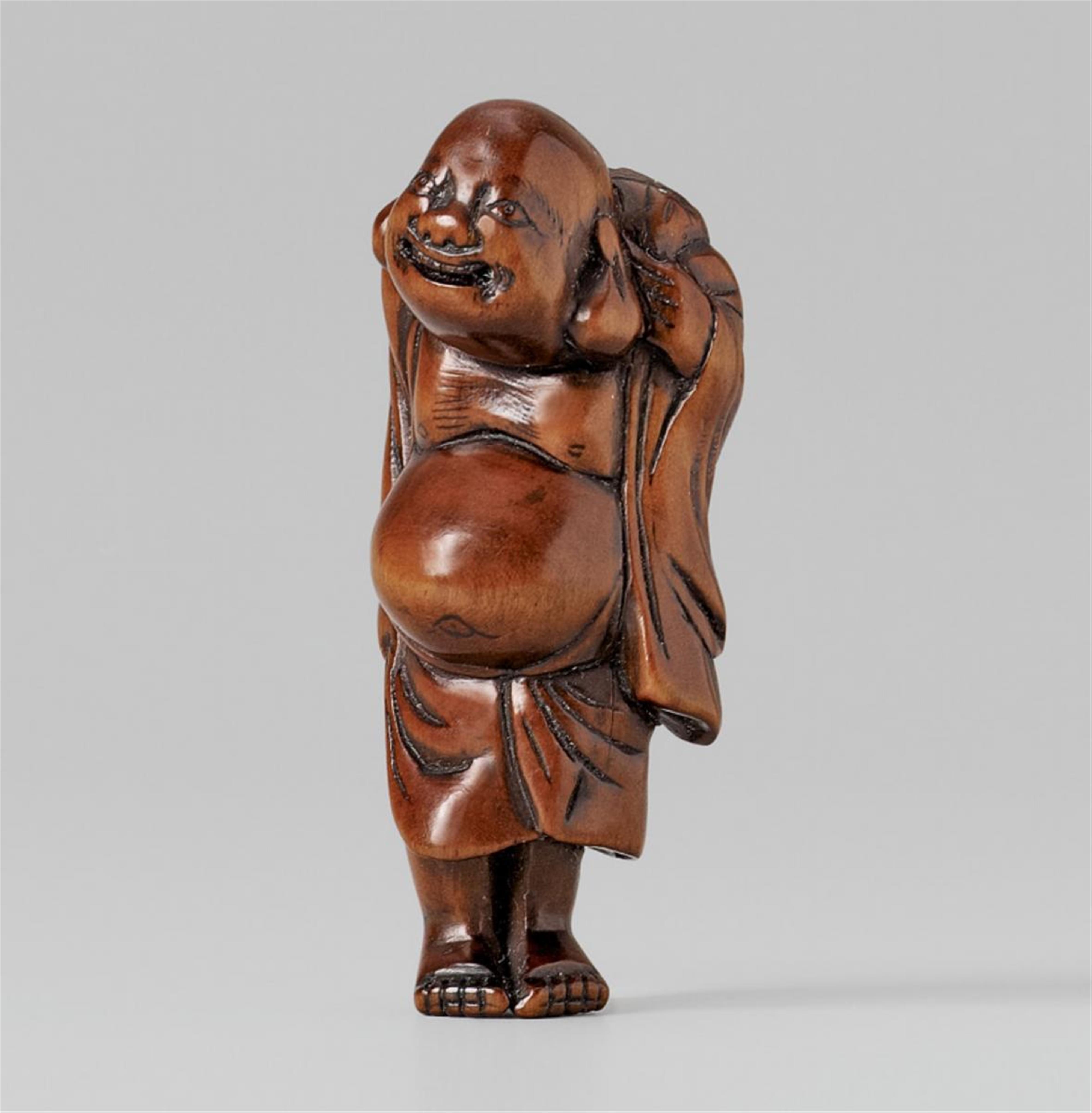 A boxwood netsuke of a laughing pot-bellied Hotei. Early 19th century - image-1