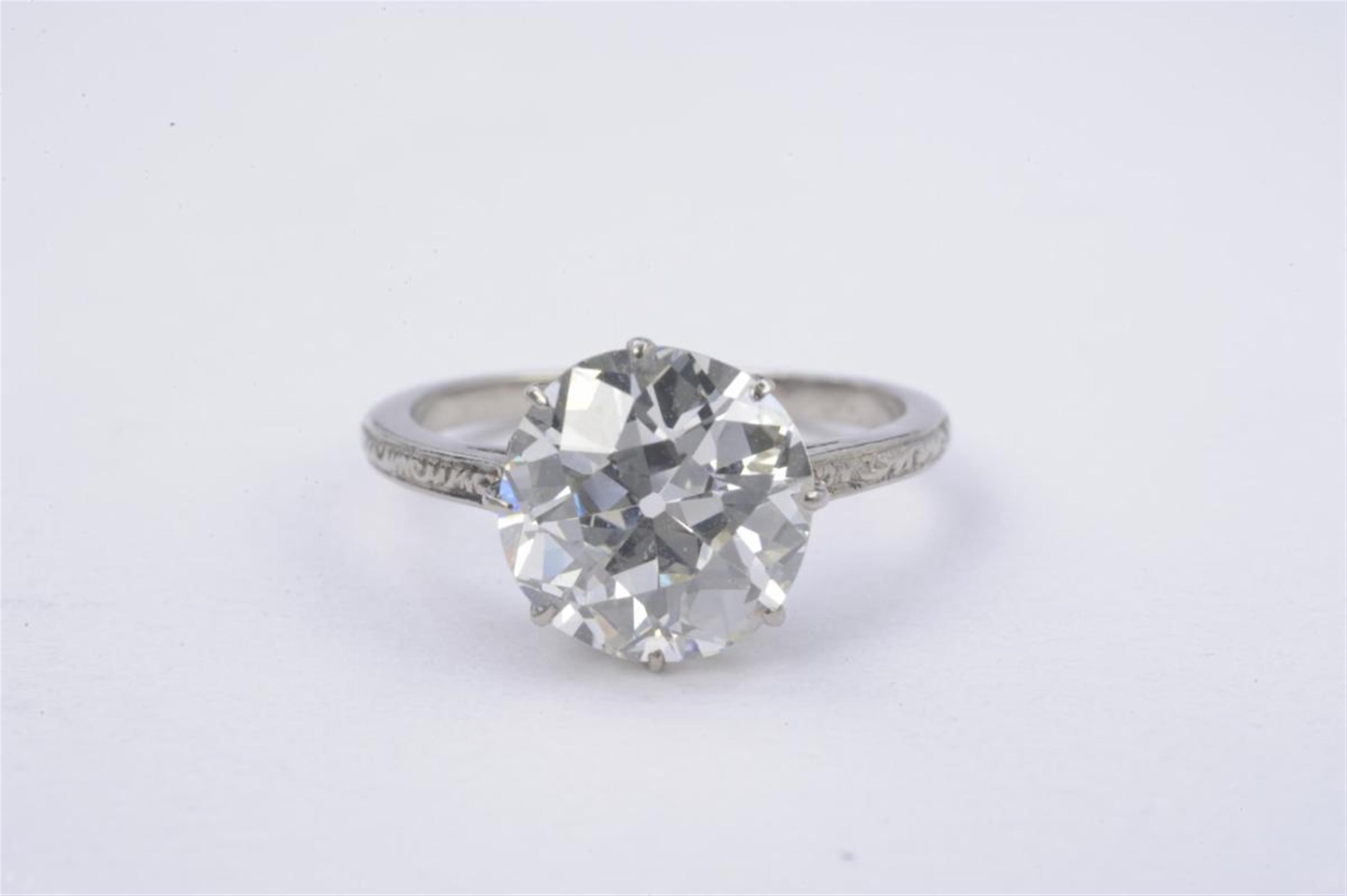 An Art Déco platinum and single diamond ring. - image-2