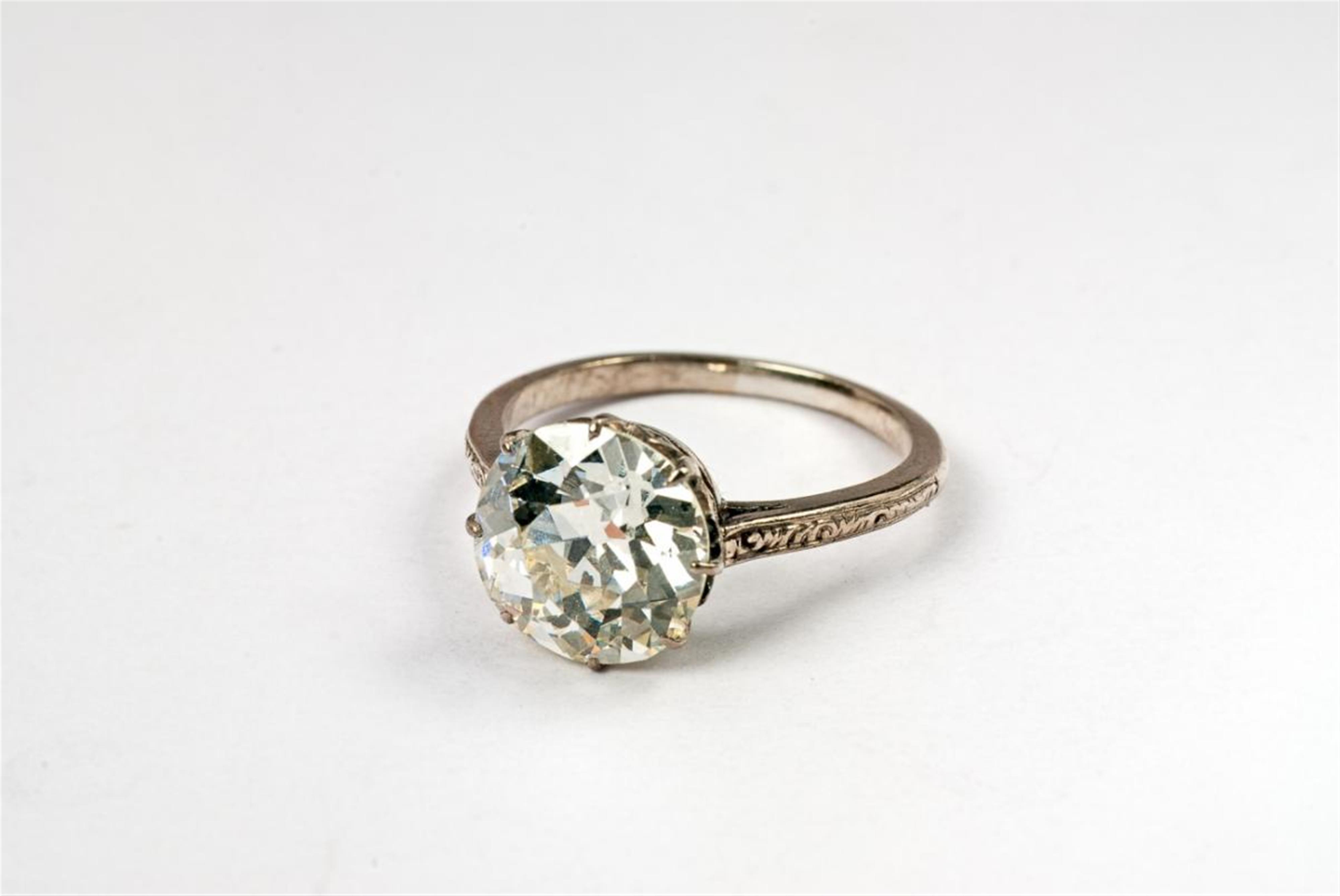 An Art Déco platinum and single diamond ring. - image-1