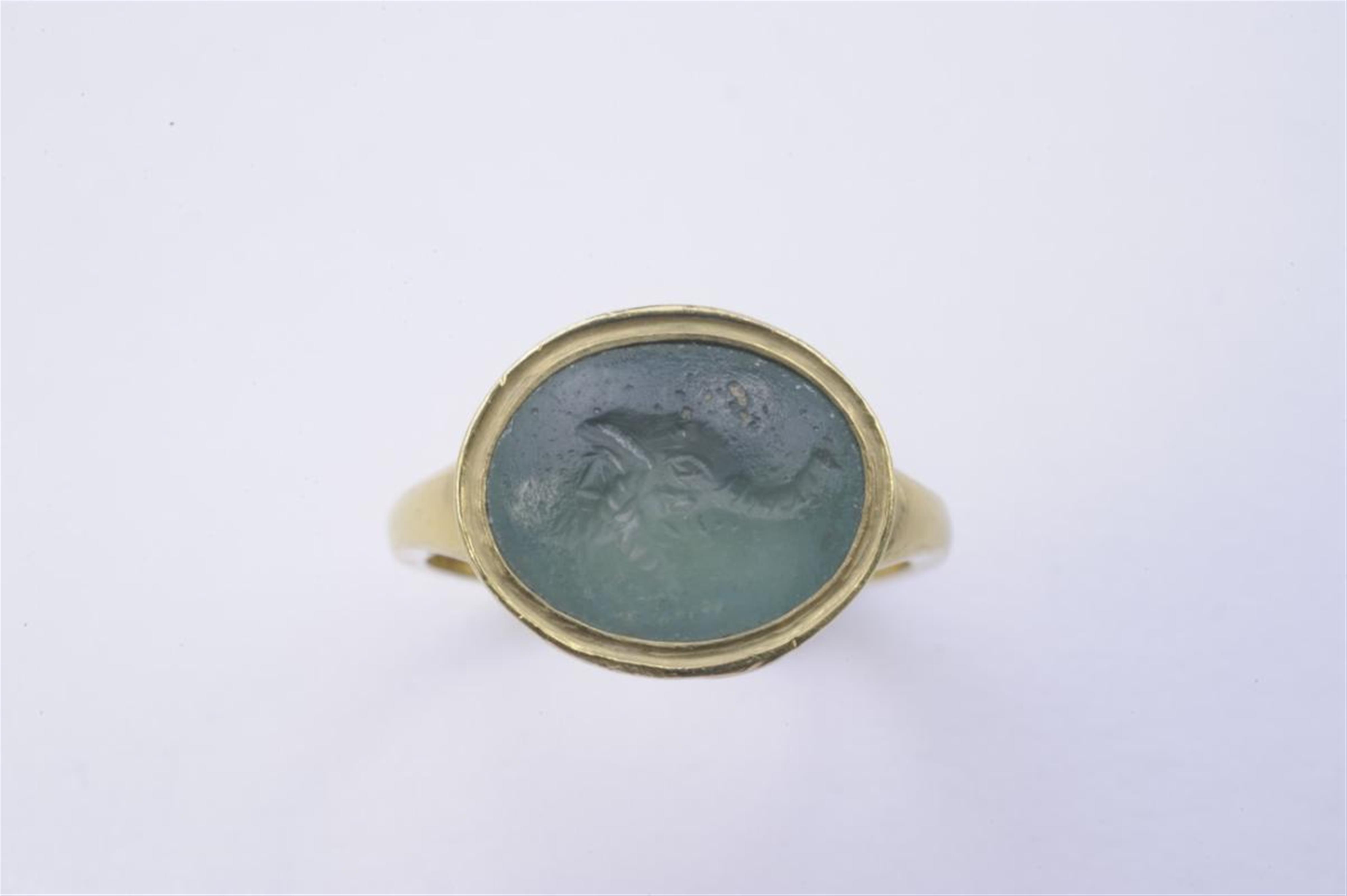 An 18k gold and glass paste Roman intaglio ring. - image-1