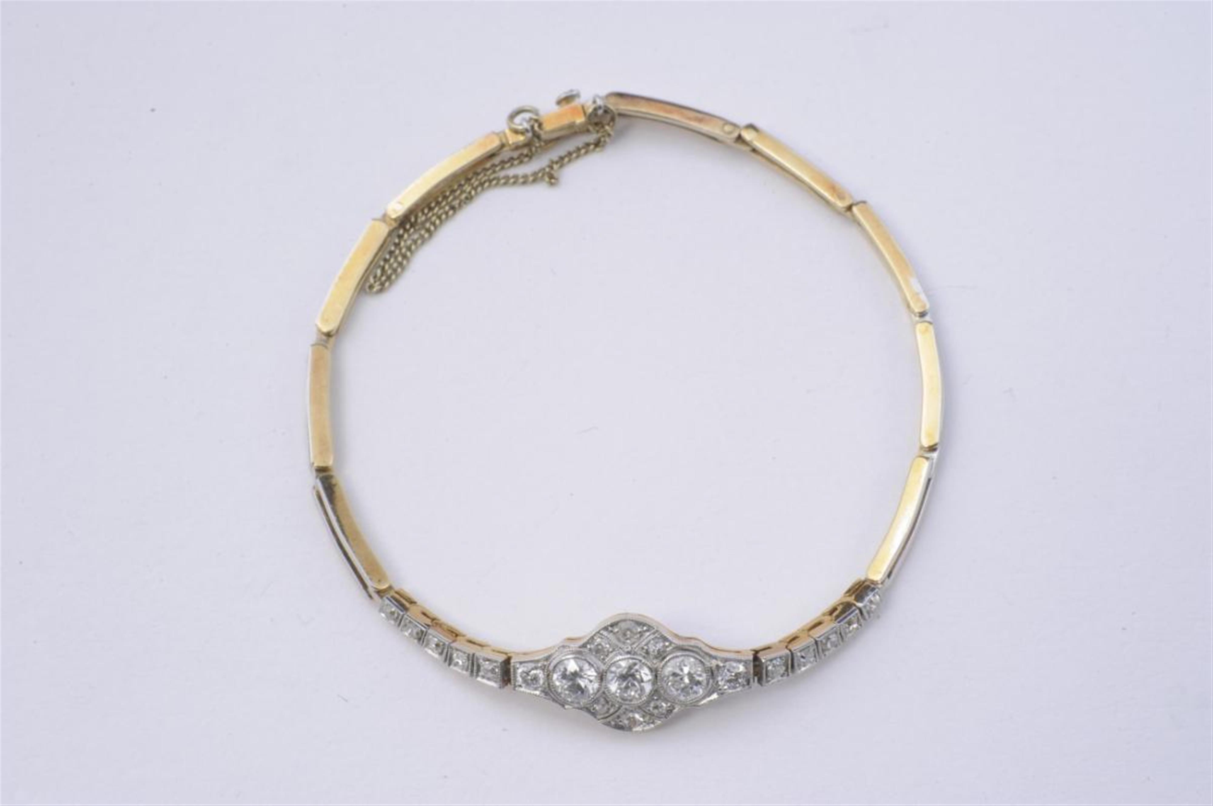 An 18k gold, platinum and diamond Art Déco bracelet. - image-1