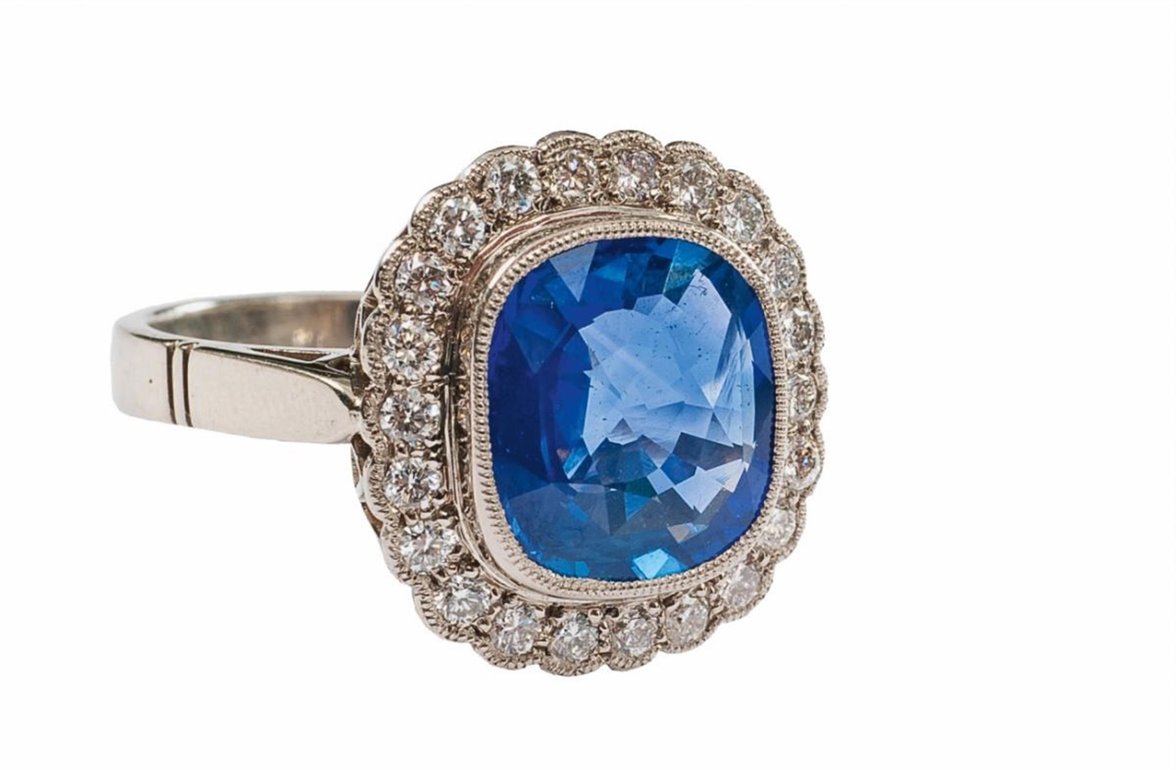 An 18k white gold sapphire cluster ring. - image-1