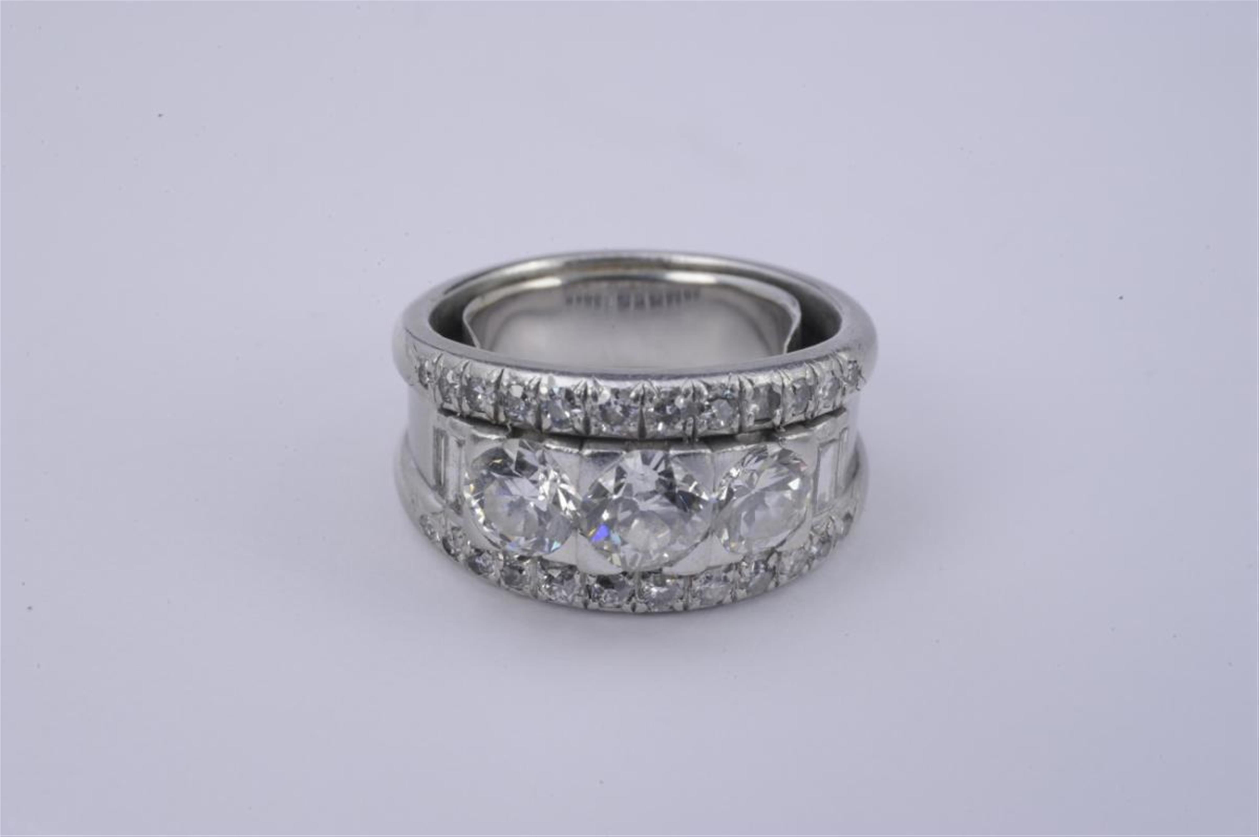 A platinum and diamond ring. - image-1