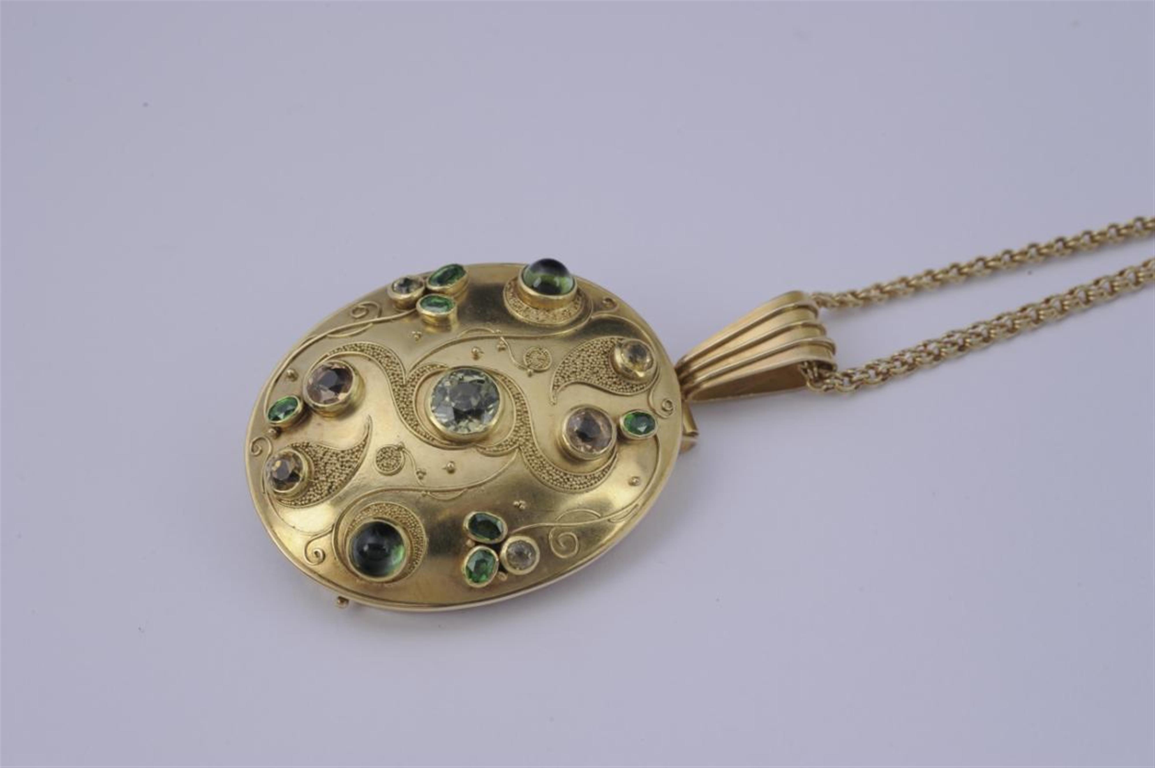 A 14k gold and coloured gem oval pendant - image-1