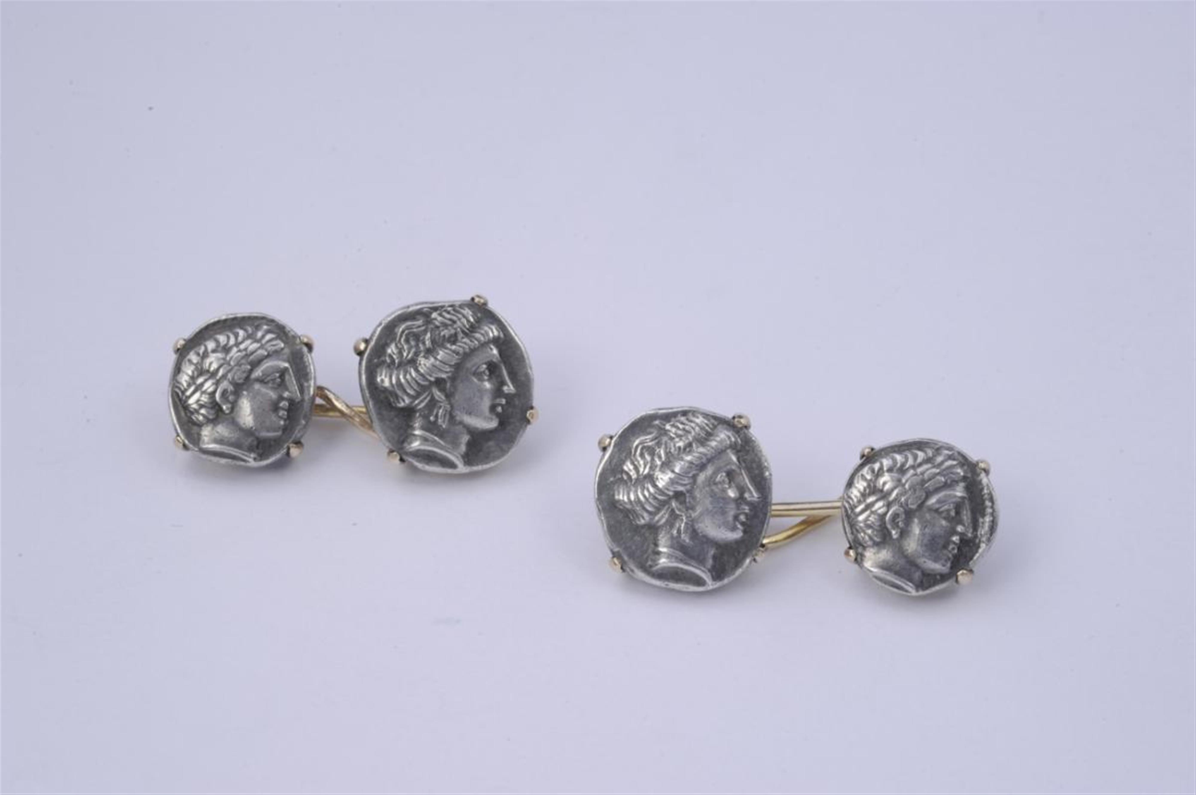 A pair of silver and 14k gold cufflinks. - image-1