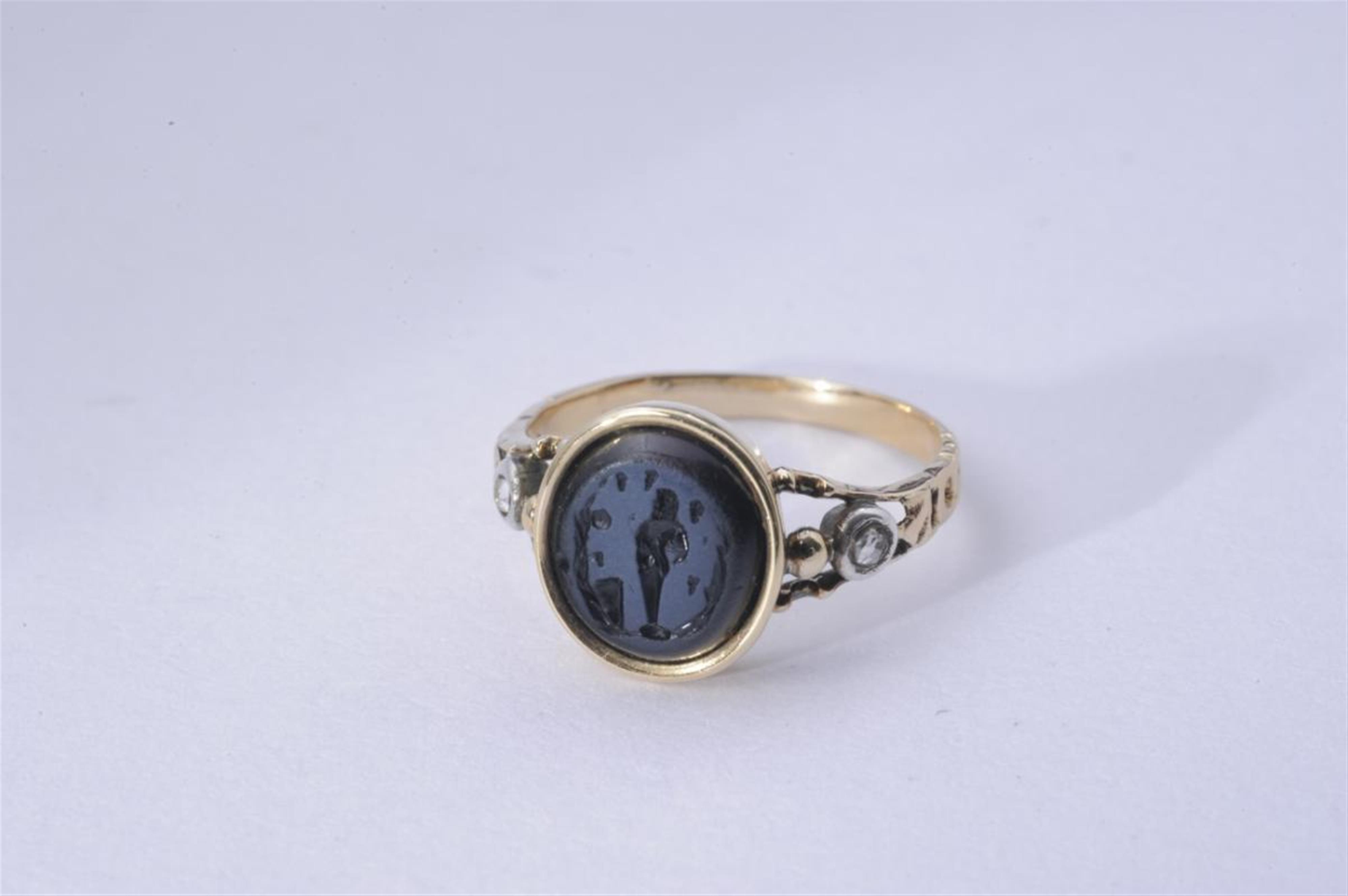 A silver and gold Roman intaglio ring. - image-1