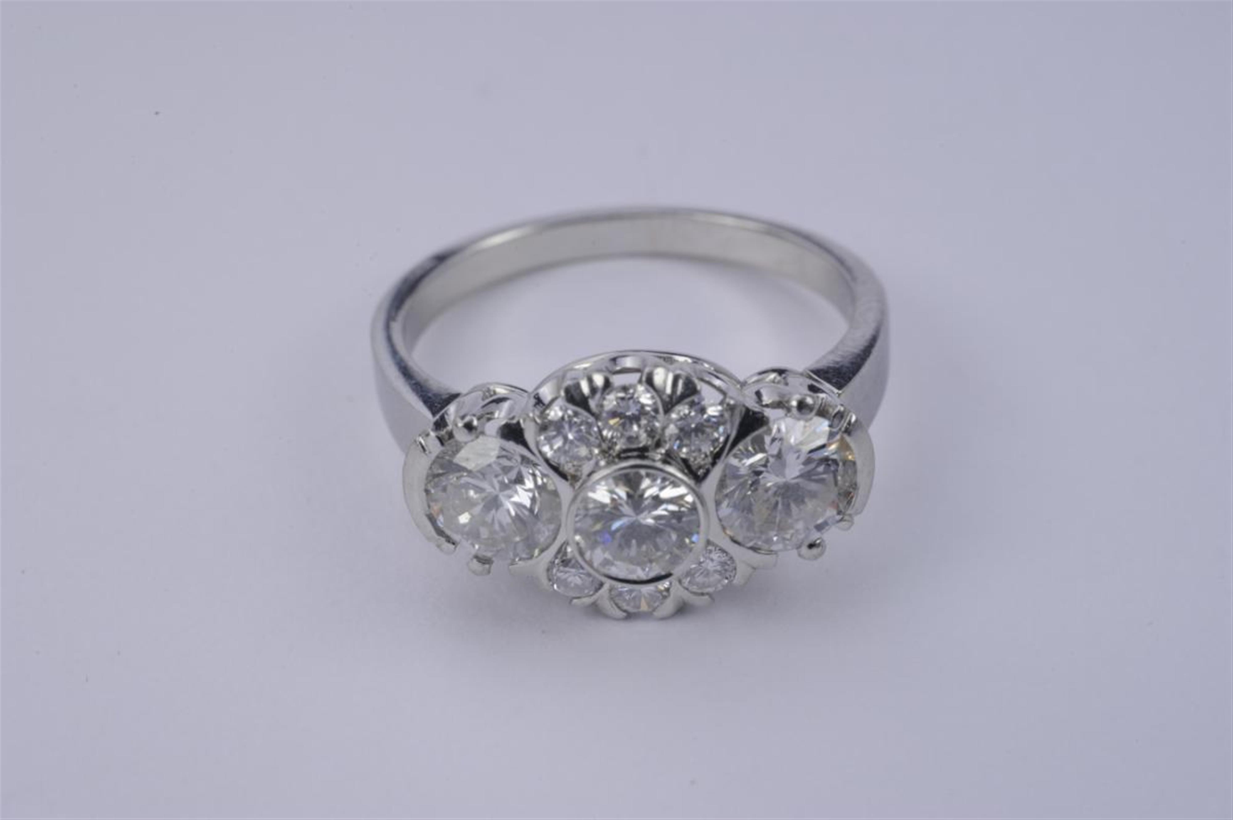 An 18k white gold diamond ring. - image-1
