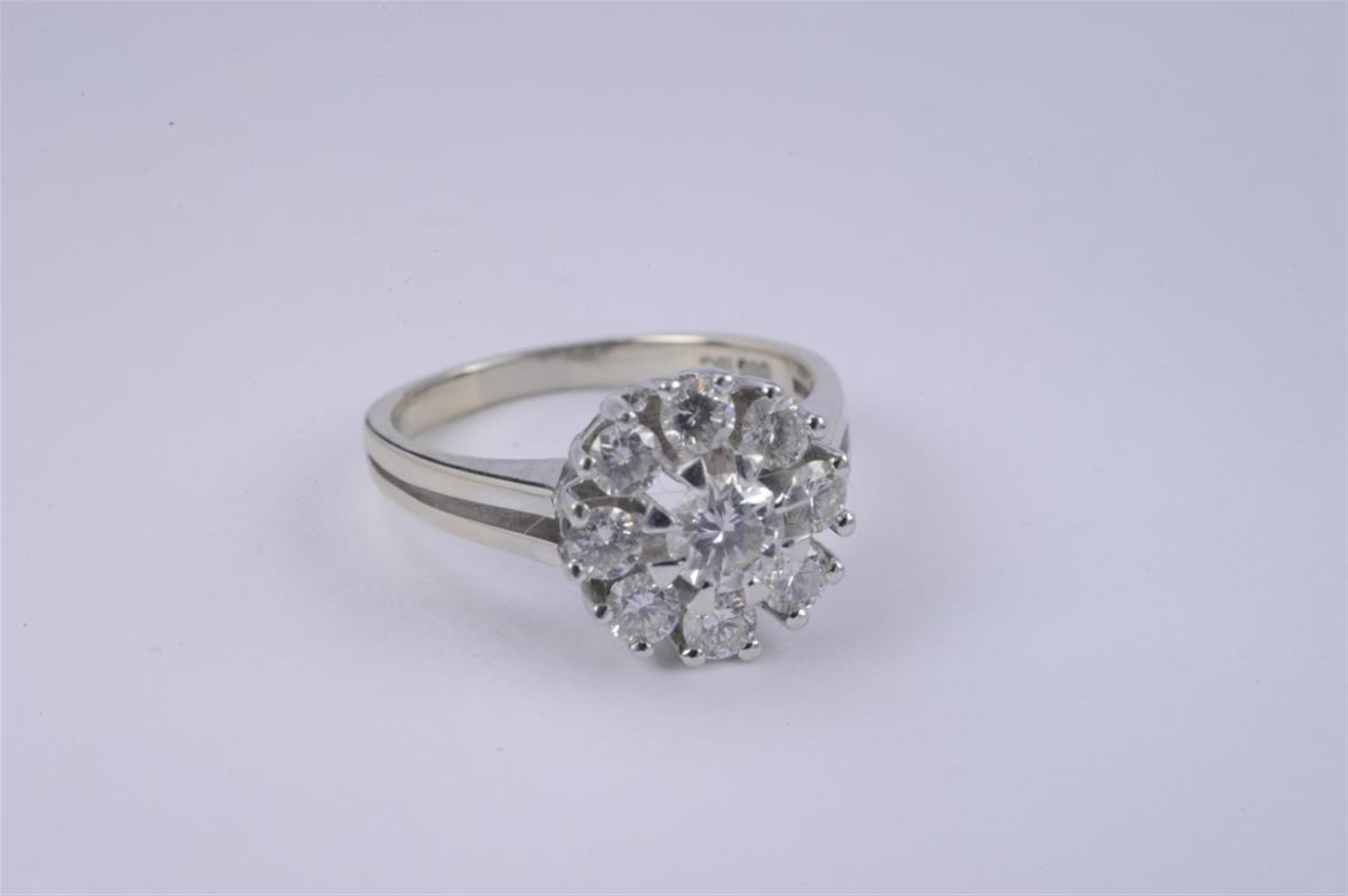 A 14k white gold and diamond cluster ring. - image-1