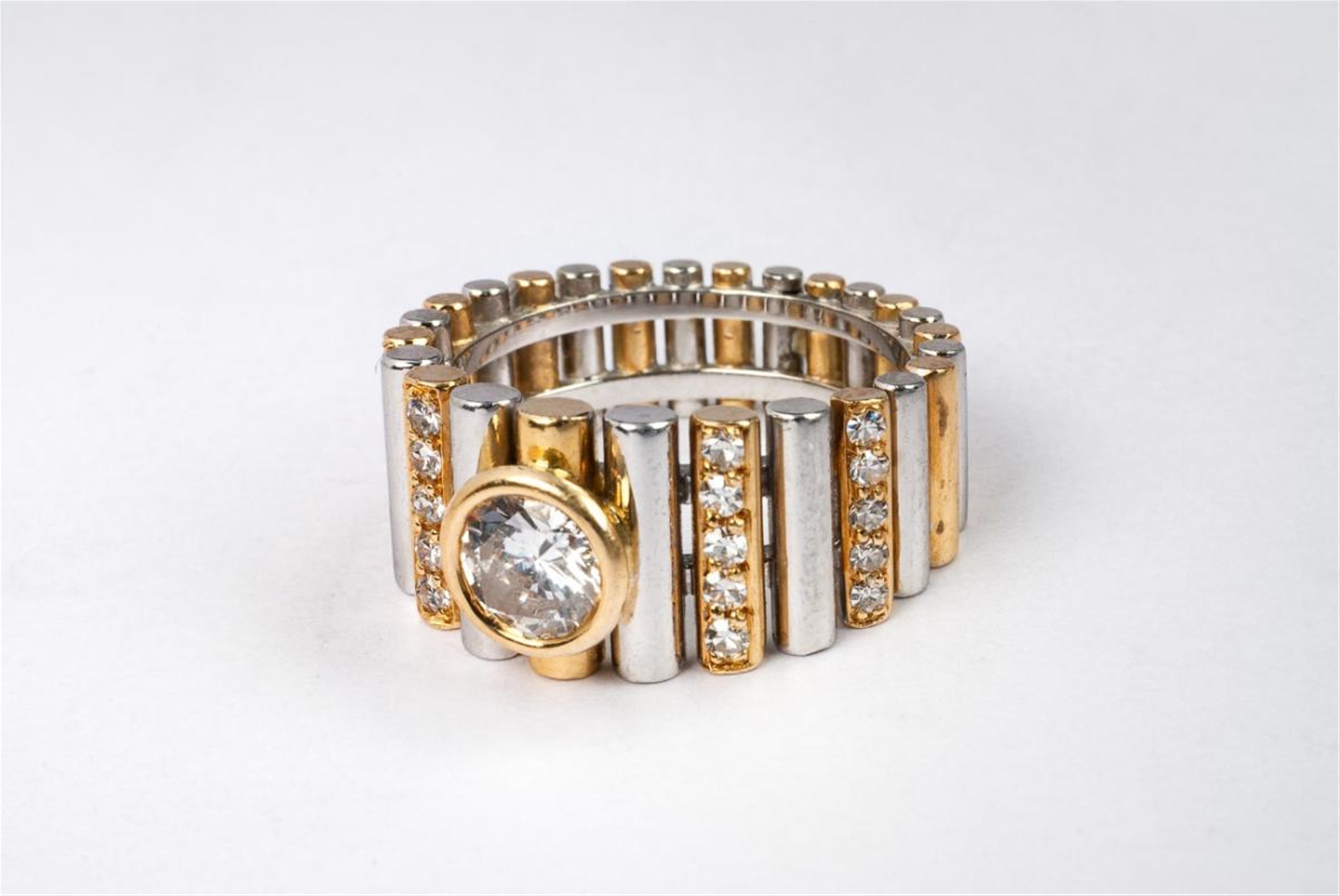 An 18k gold diamond solitaire ring by Bucherer. - image-1