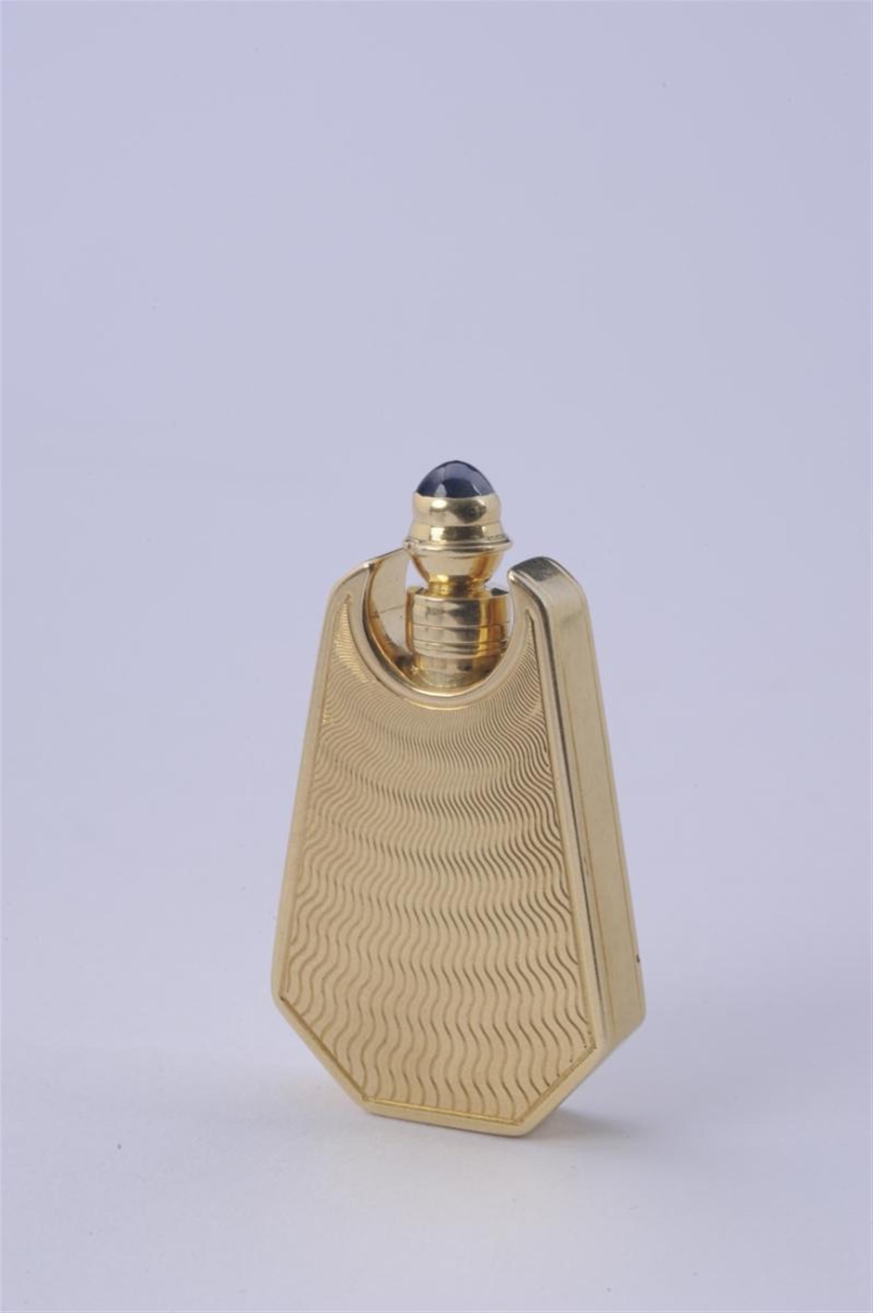 A Parisian 18k guilloché gold perfume bottle. - image-1