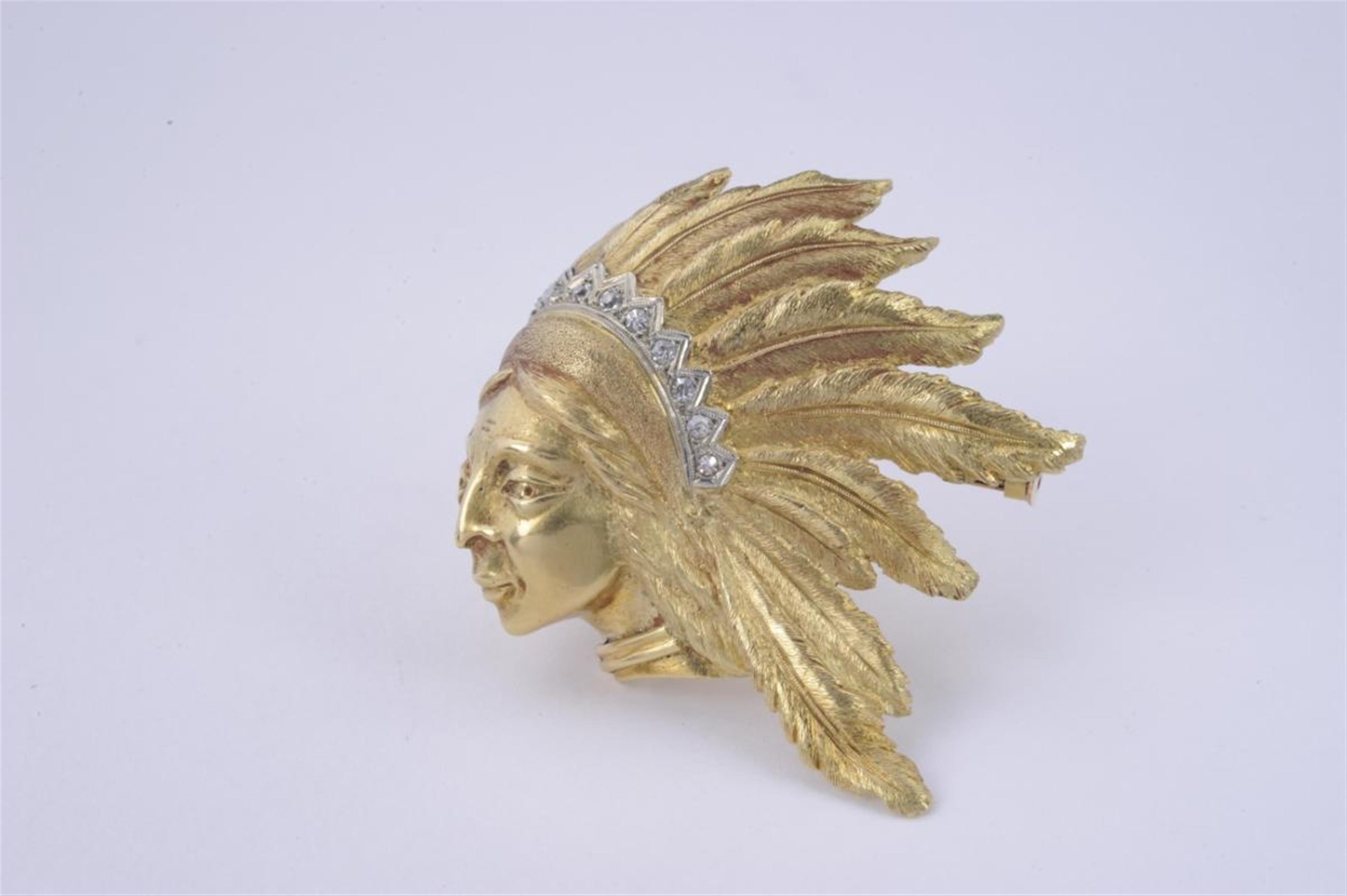 An 18k gold Argentinian brooch formed as the head of an Indian - image-1