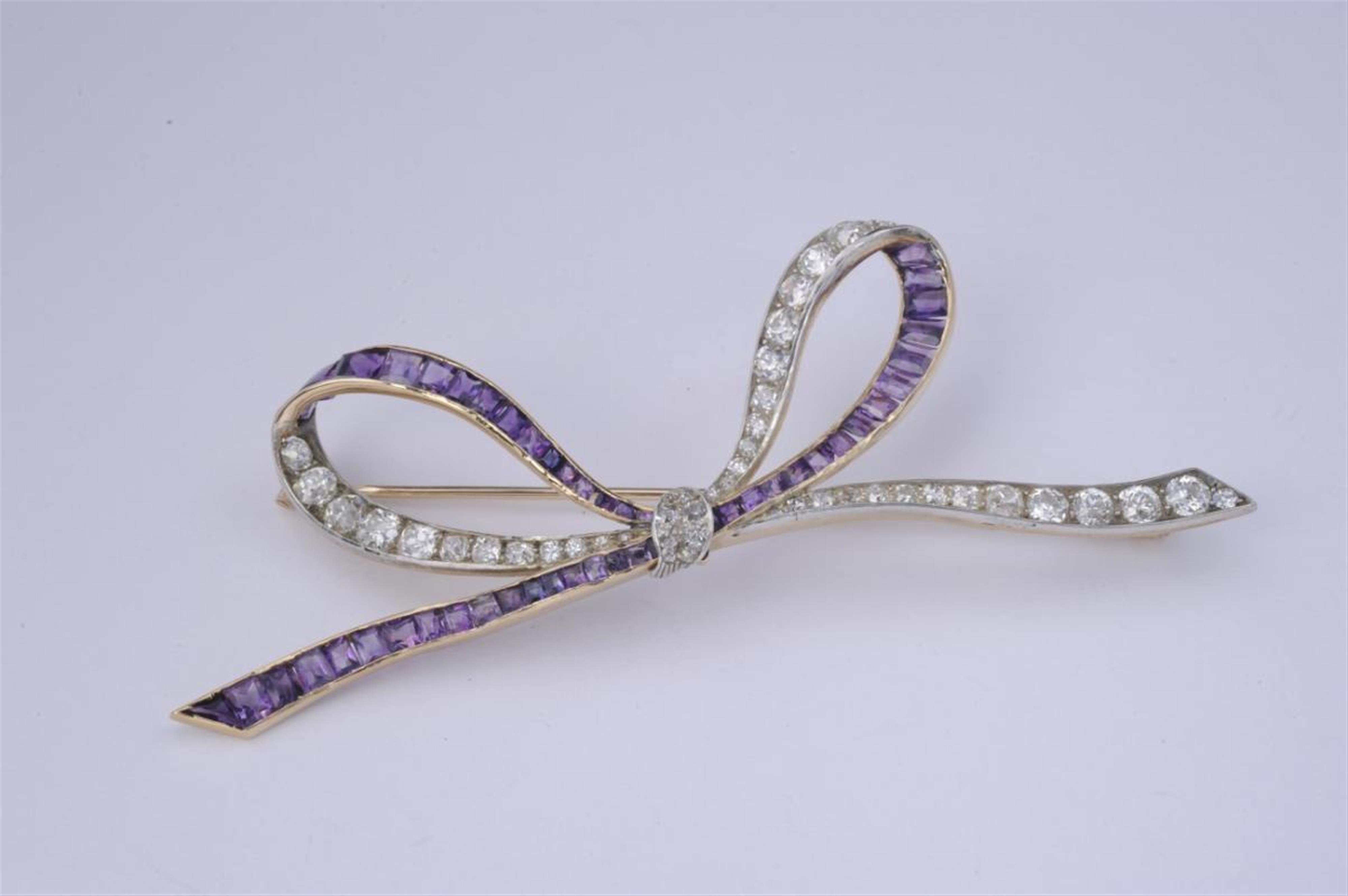 A large, 14k gold Viennese brooch formed as a bow. - image-1