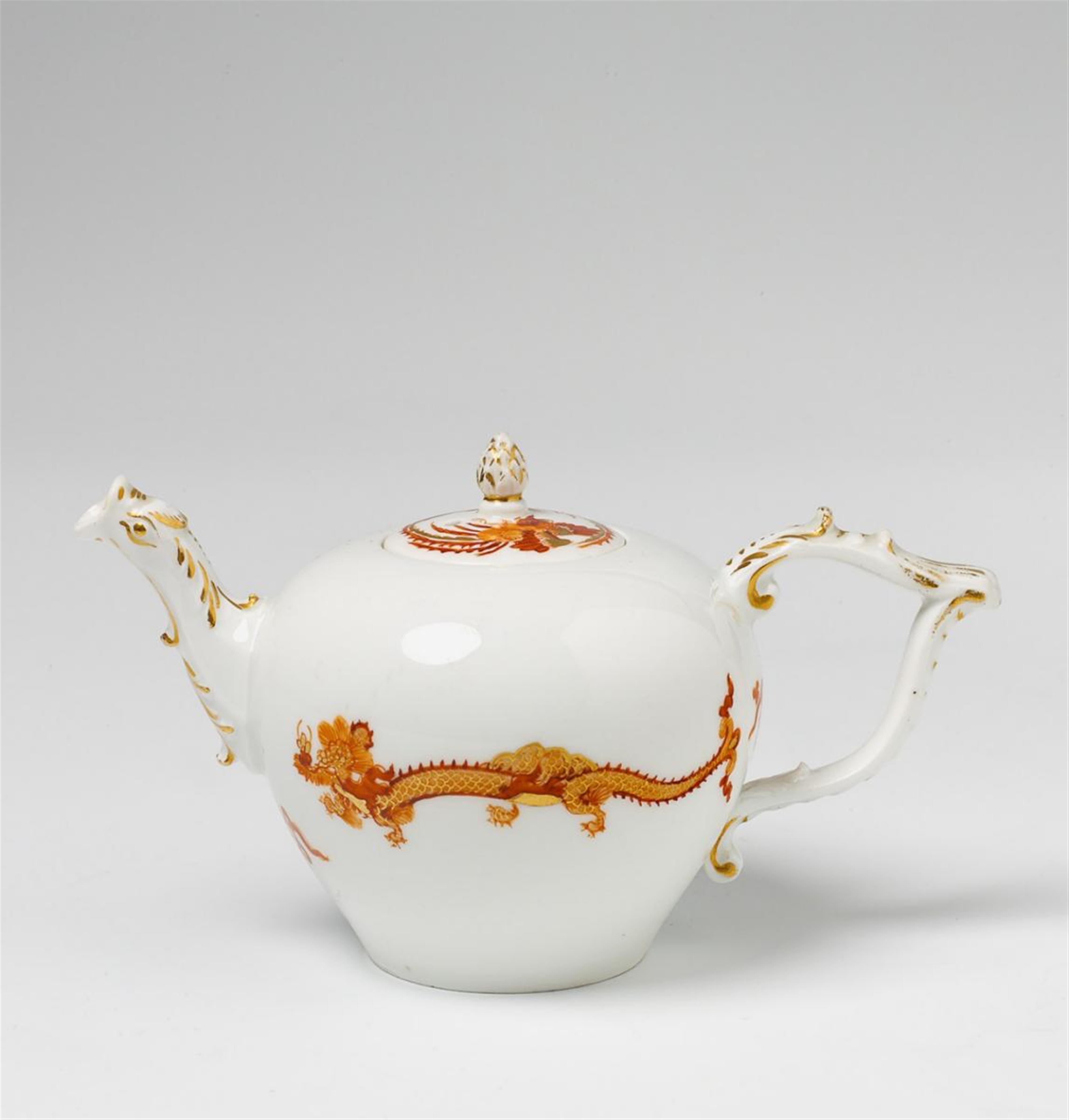 A Meissen teapot with dragon and phoenix decor. - image-1