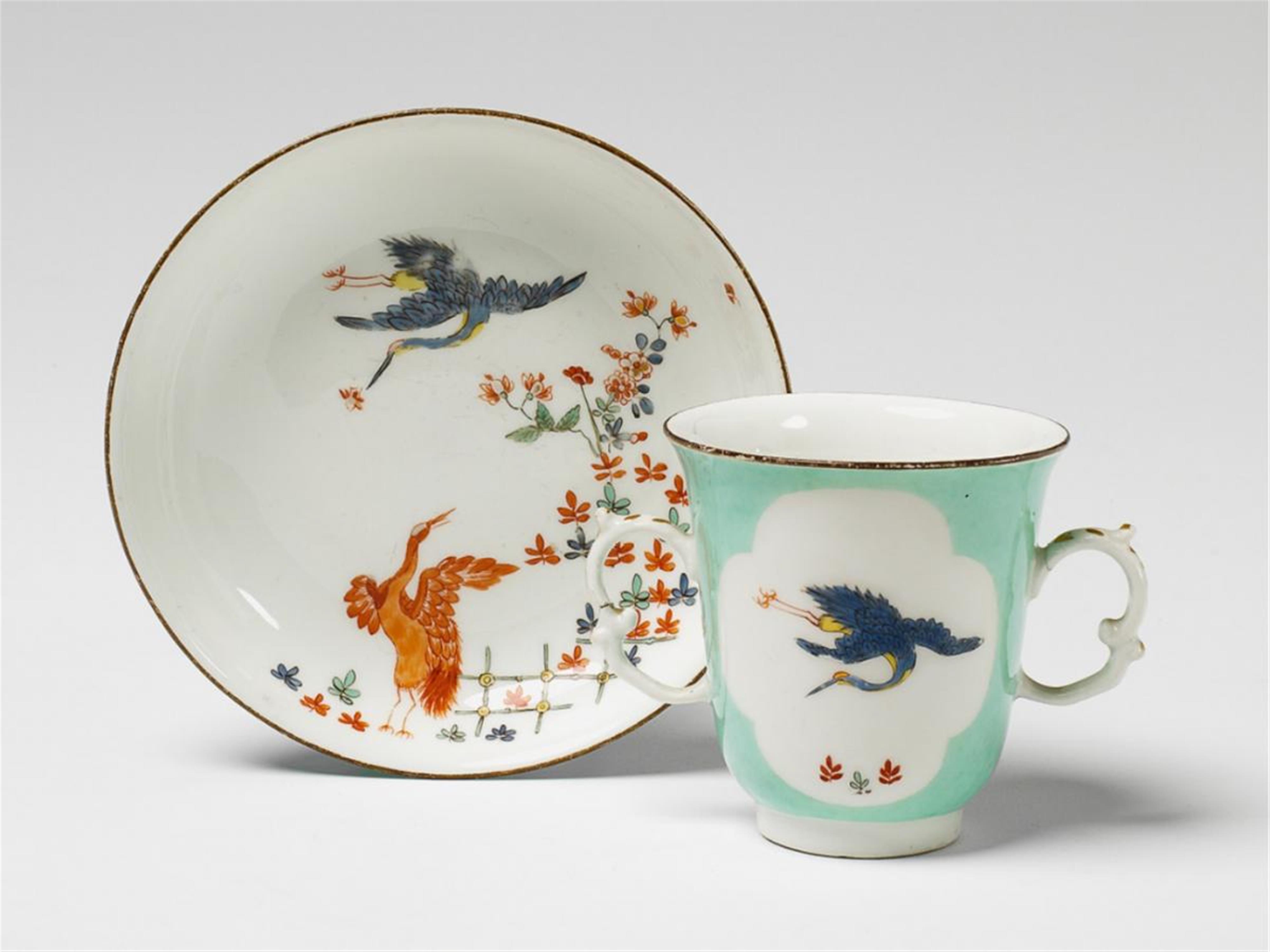 A Meissen cup and saucer decorated with cranes and indianische blumen. - image-1